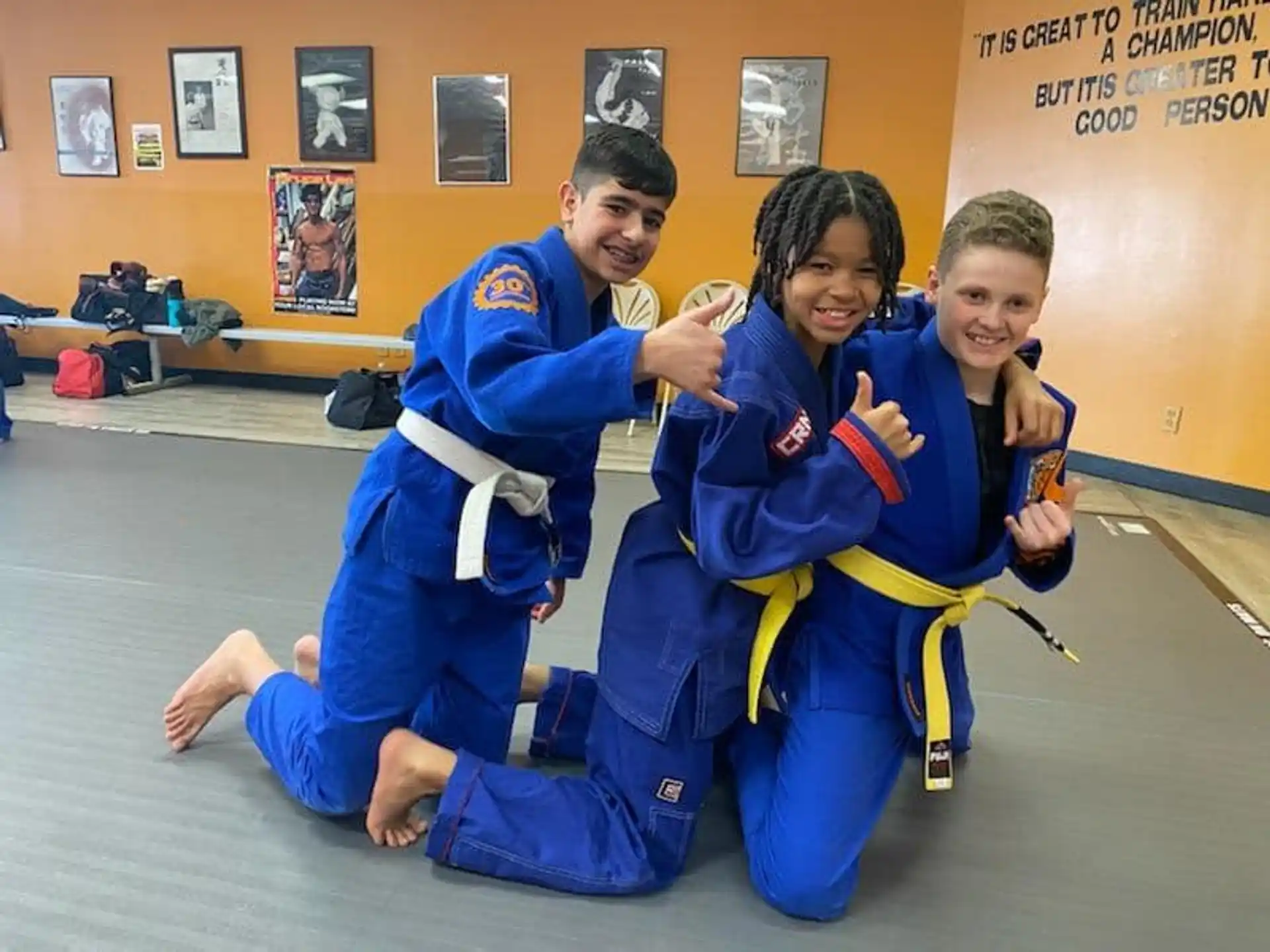 a group of people in blue karate uniforms