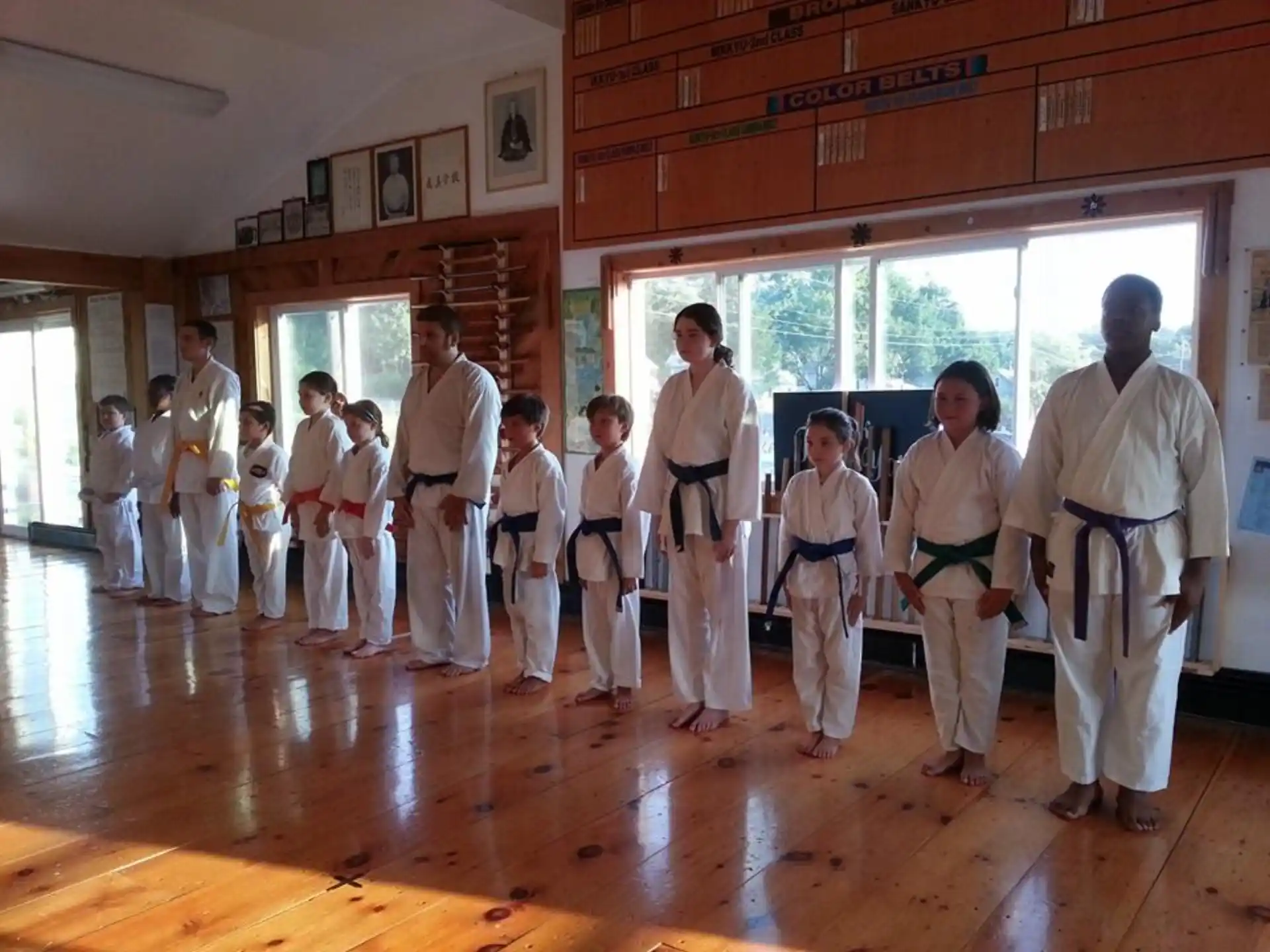 a group of people in karate uniforms