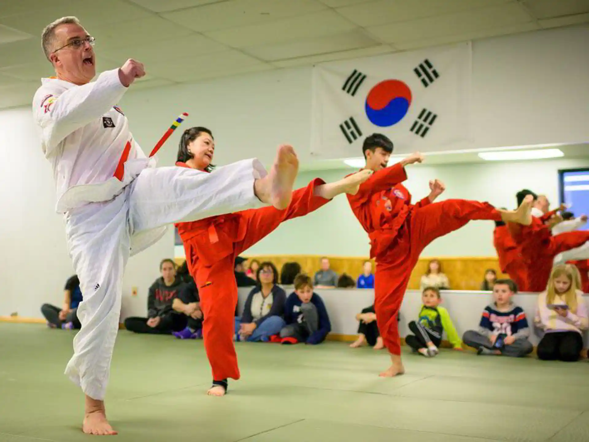 a group of people in a karate class