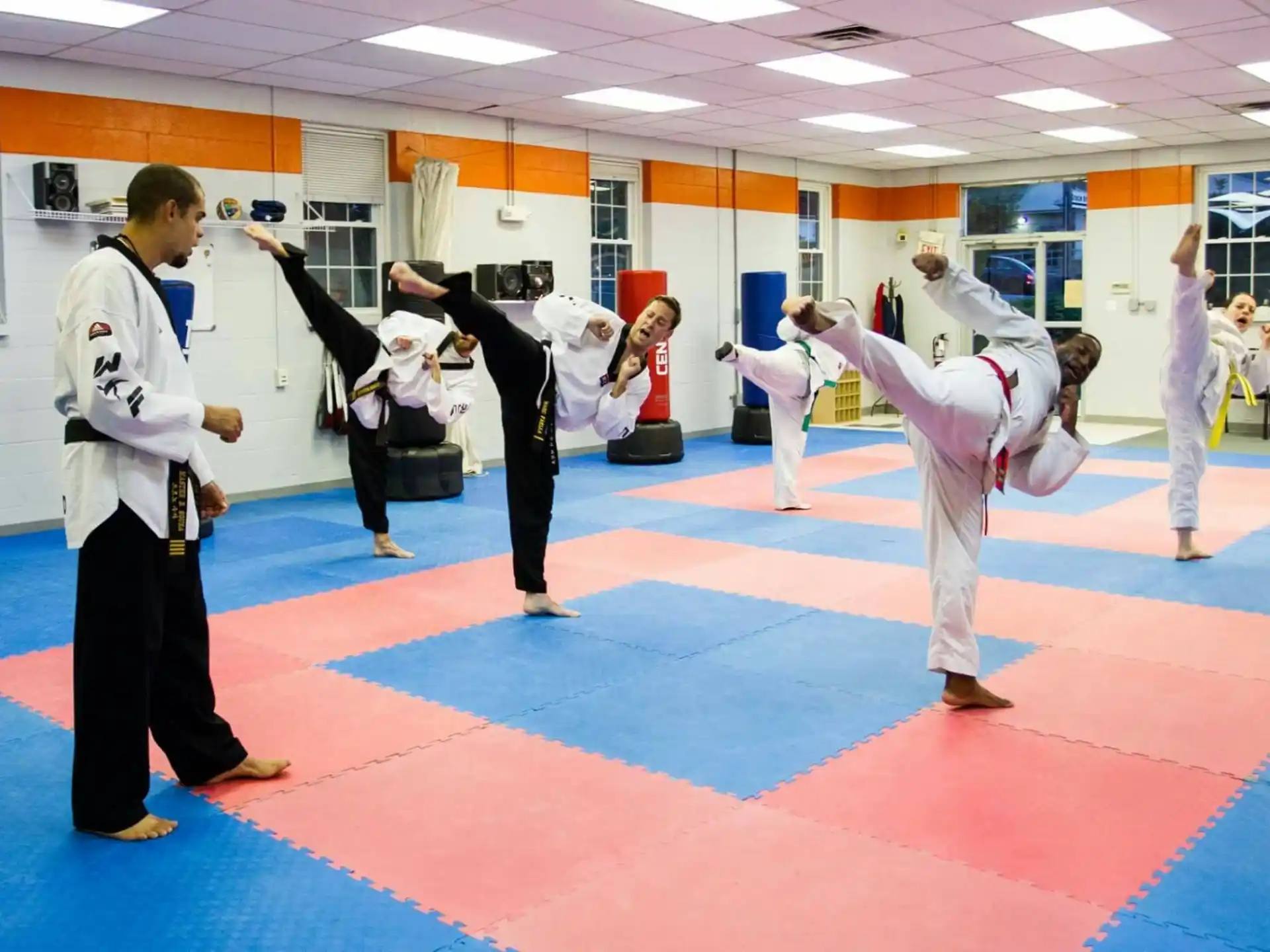 a group of people in karate uniforms