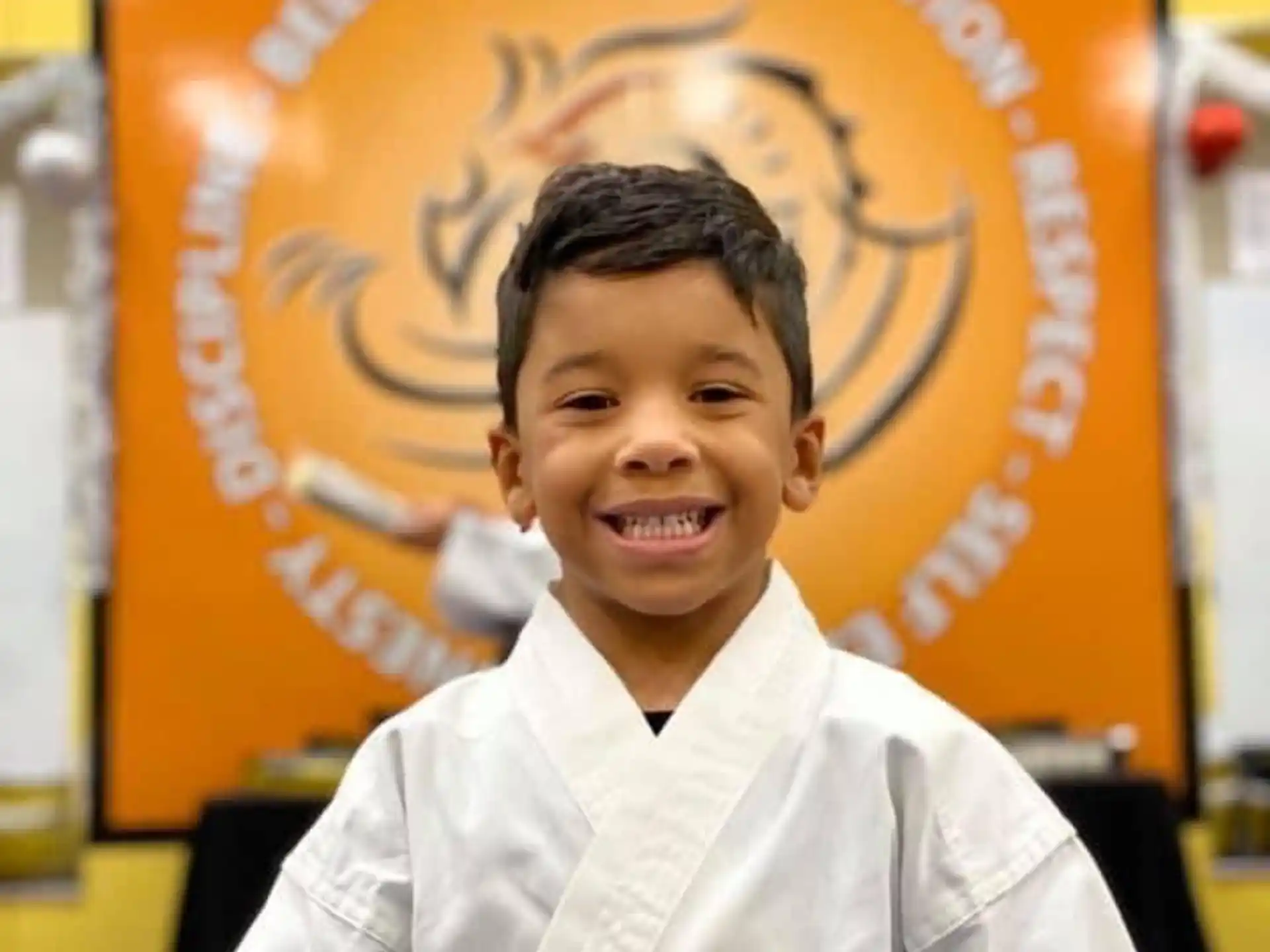 a boy smiling for the camera