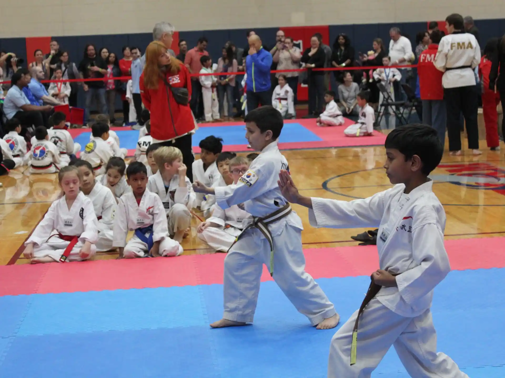 a group of children in karate uniforms