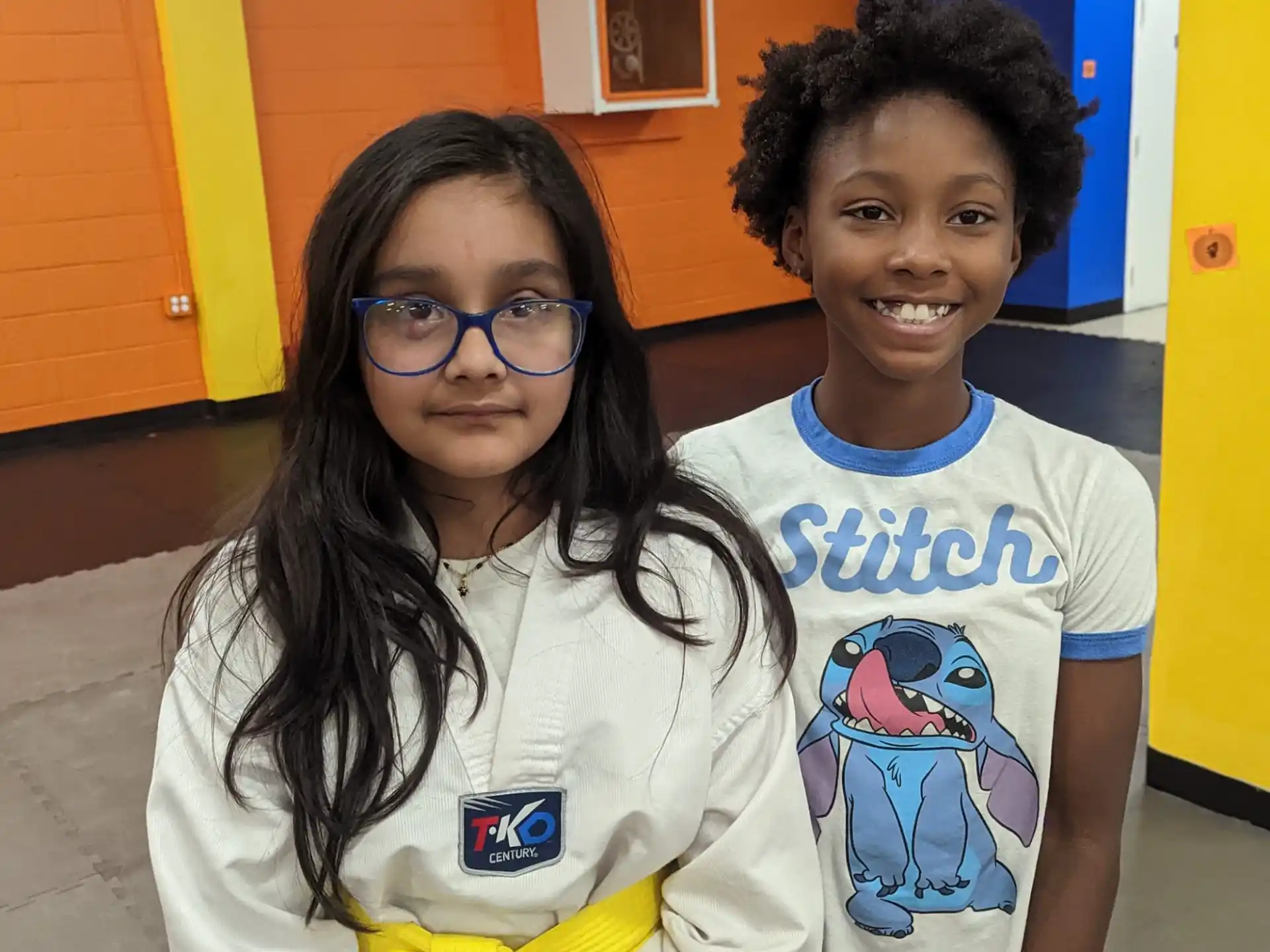a couple of children smiling