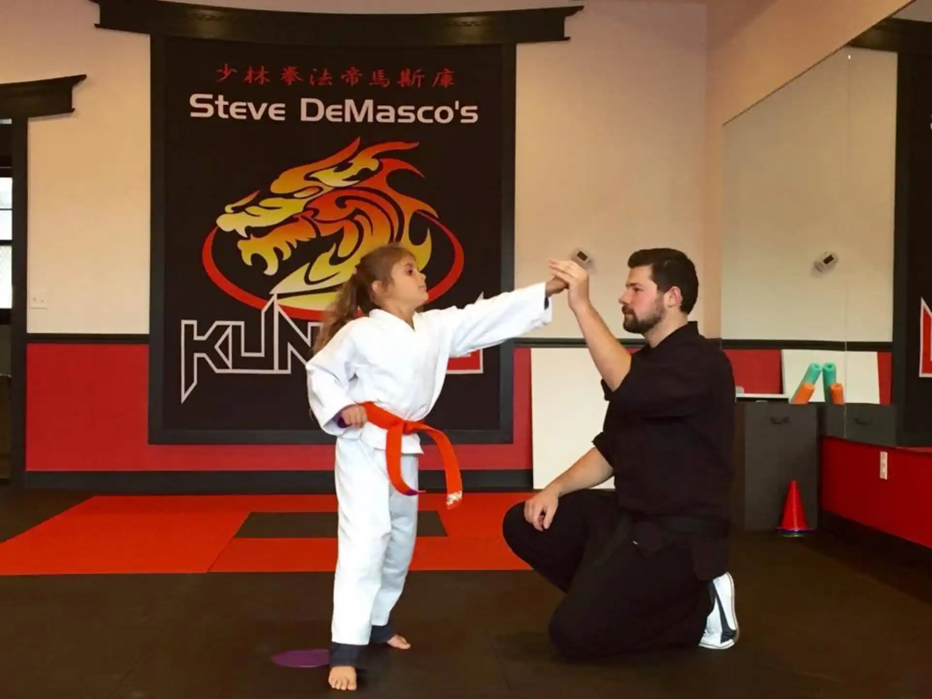 a man and a woman in karate uniforms