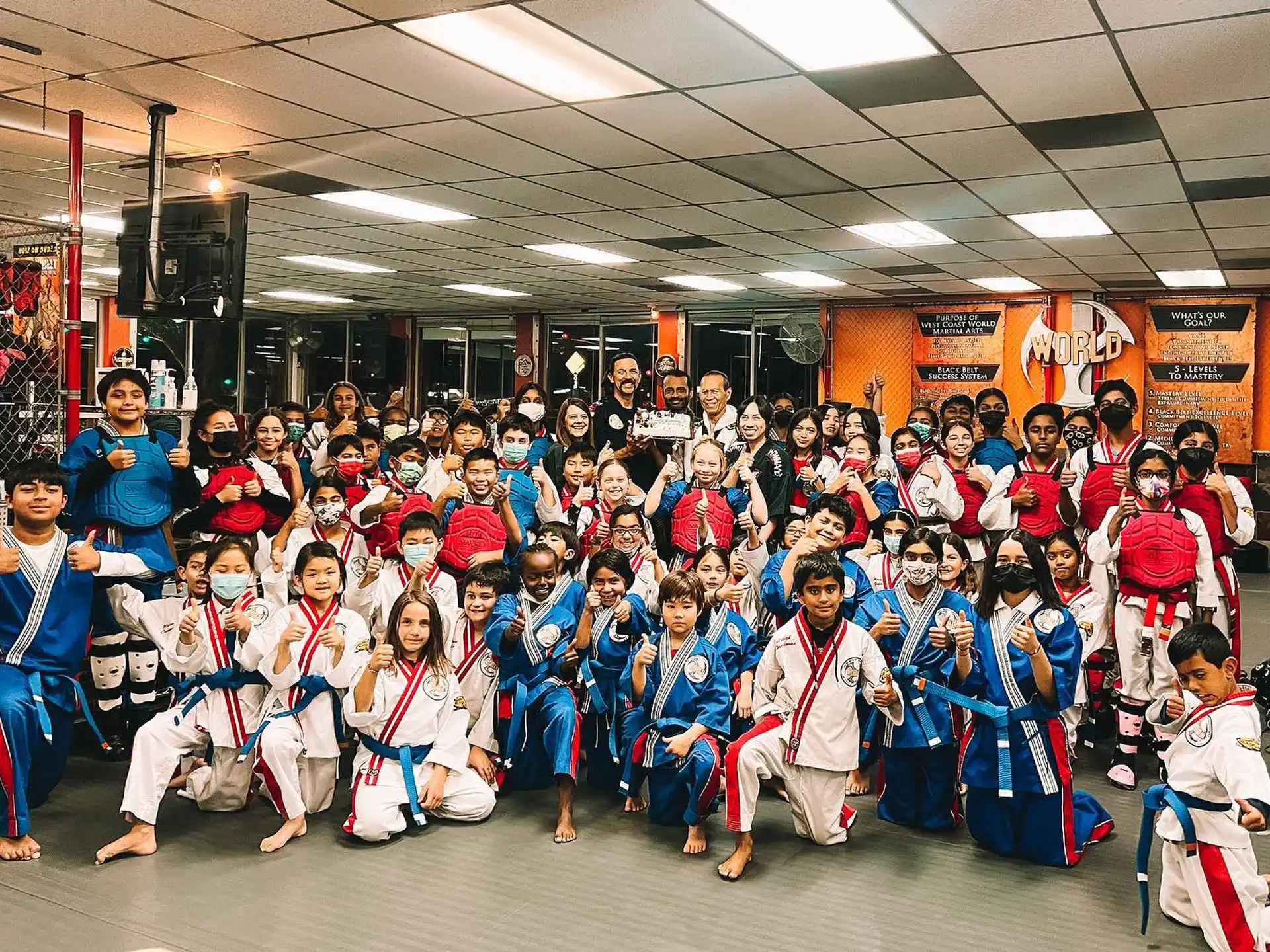 a group of people in karate uniforms
