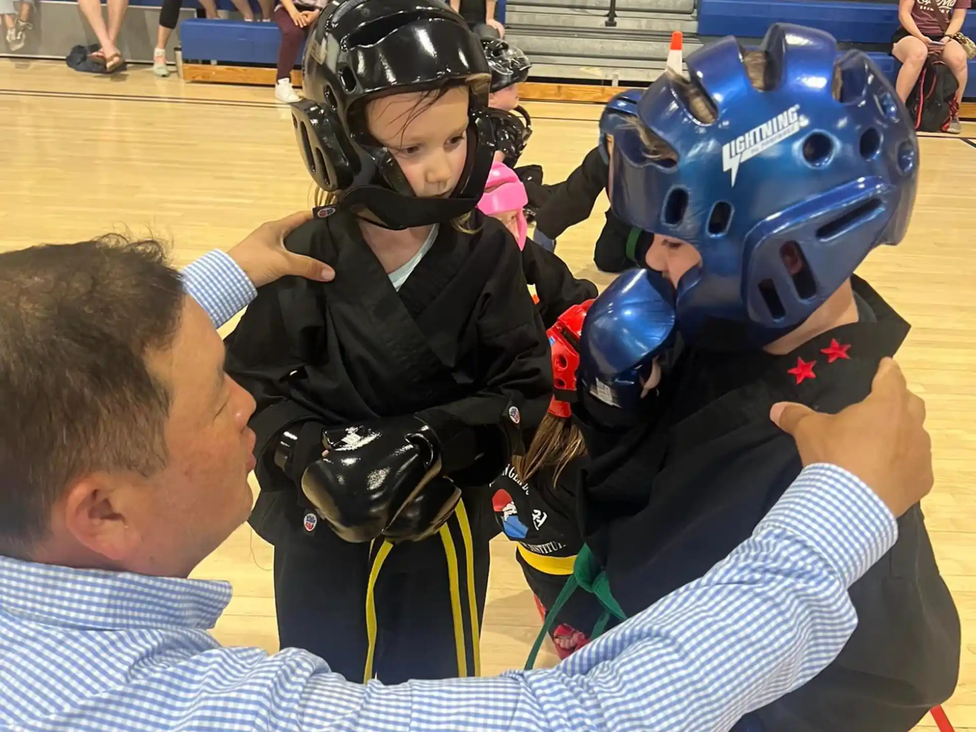a man and a child wearing helmets