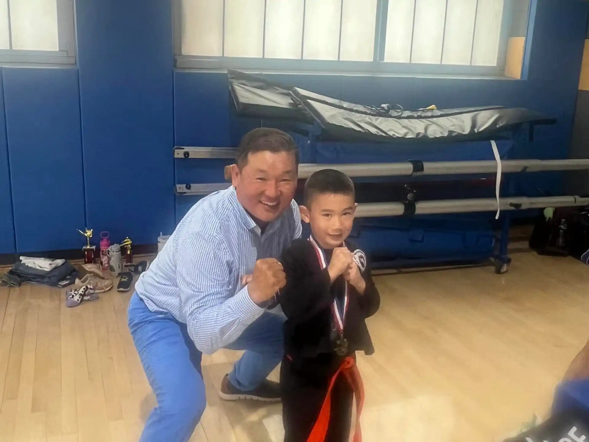 a person and a boy posing for a picture