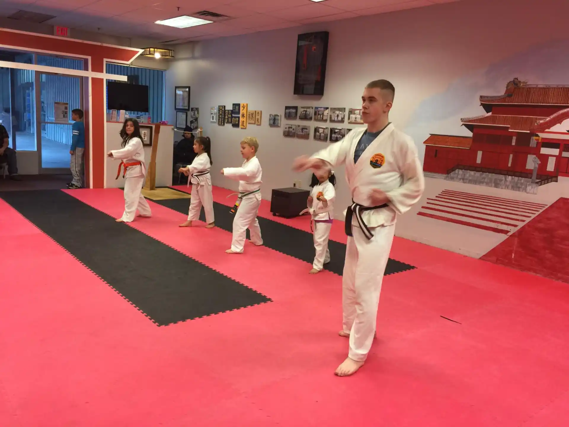 a group of people in karate uniforms