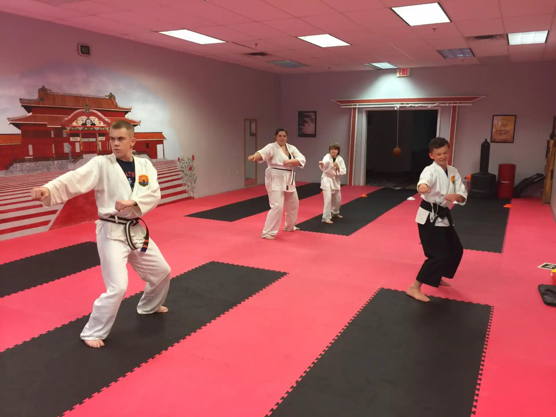 a group of people in karate uniforms