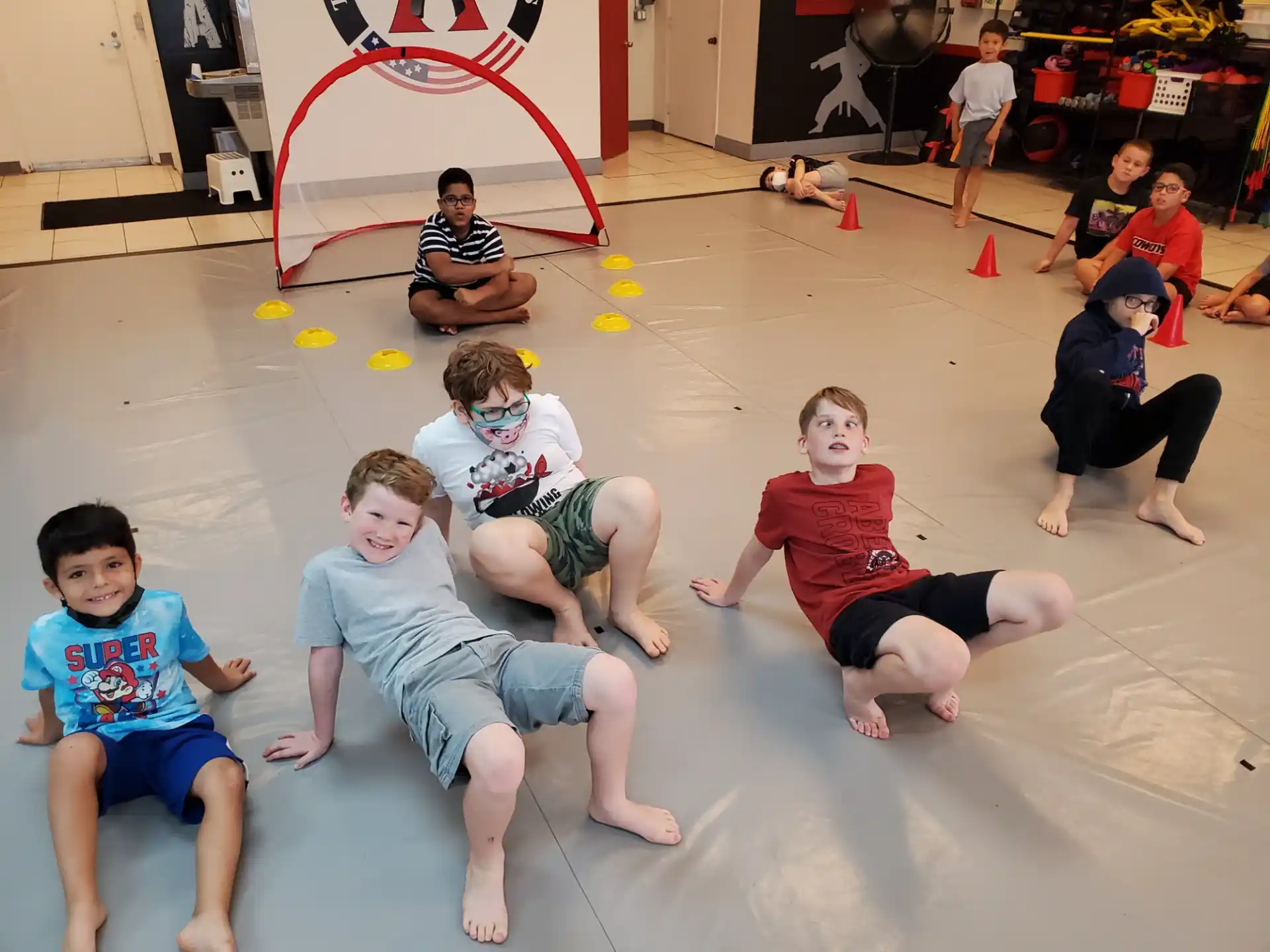 a group of boys sitting on the floor