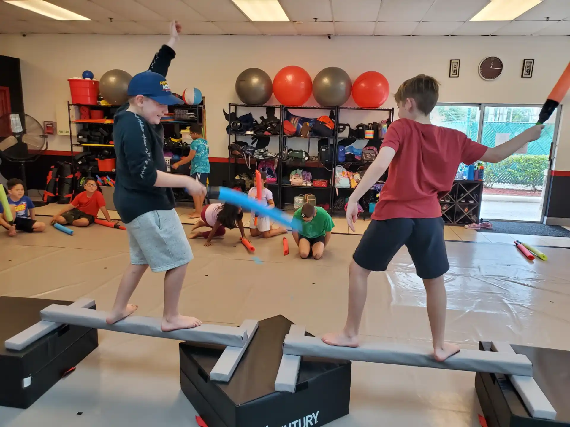a group of kids playing with balls