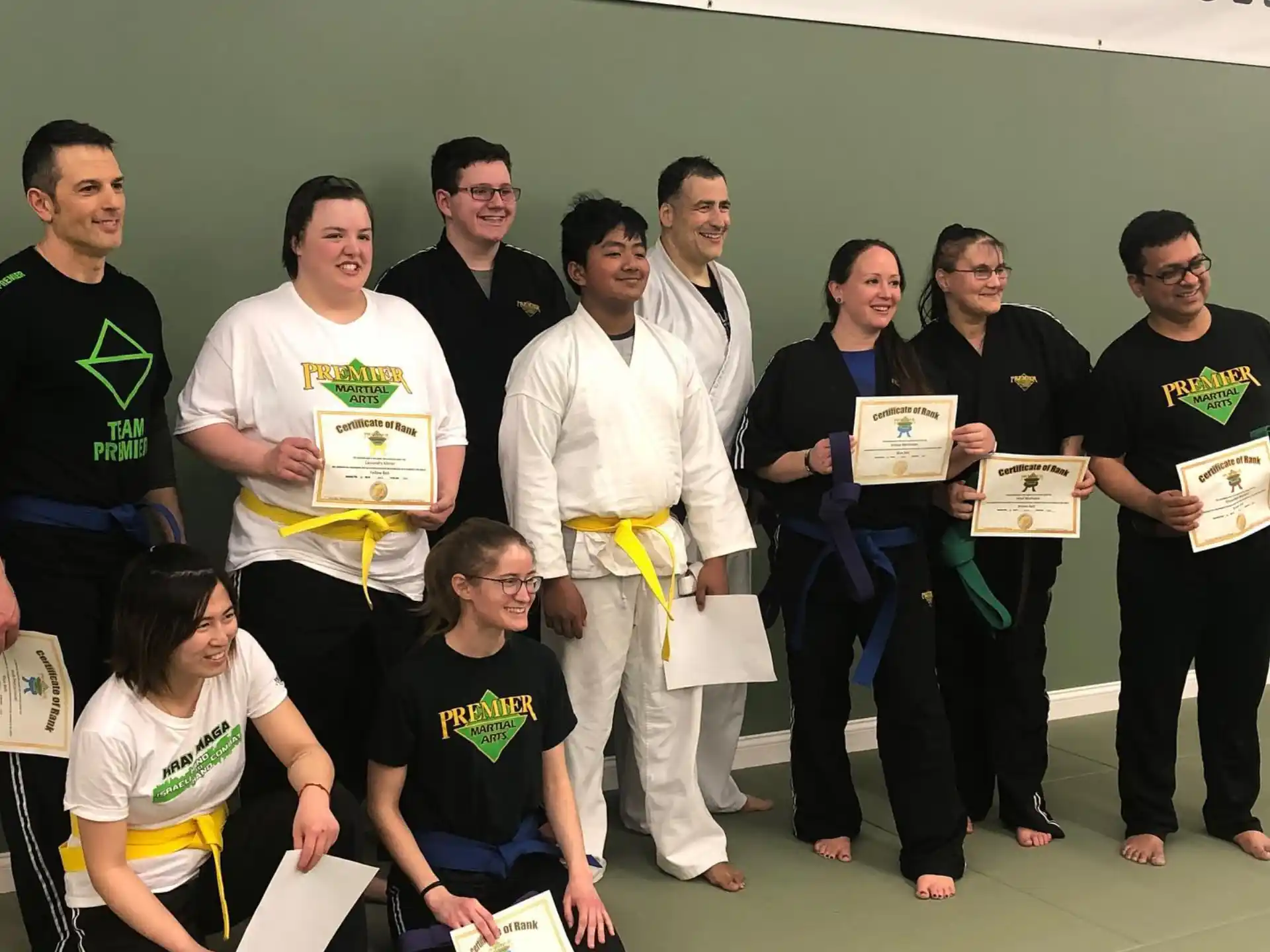 a group of people holding certificates