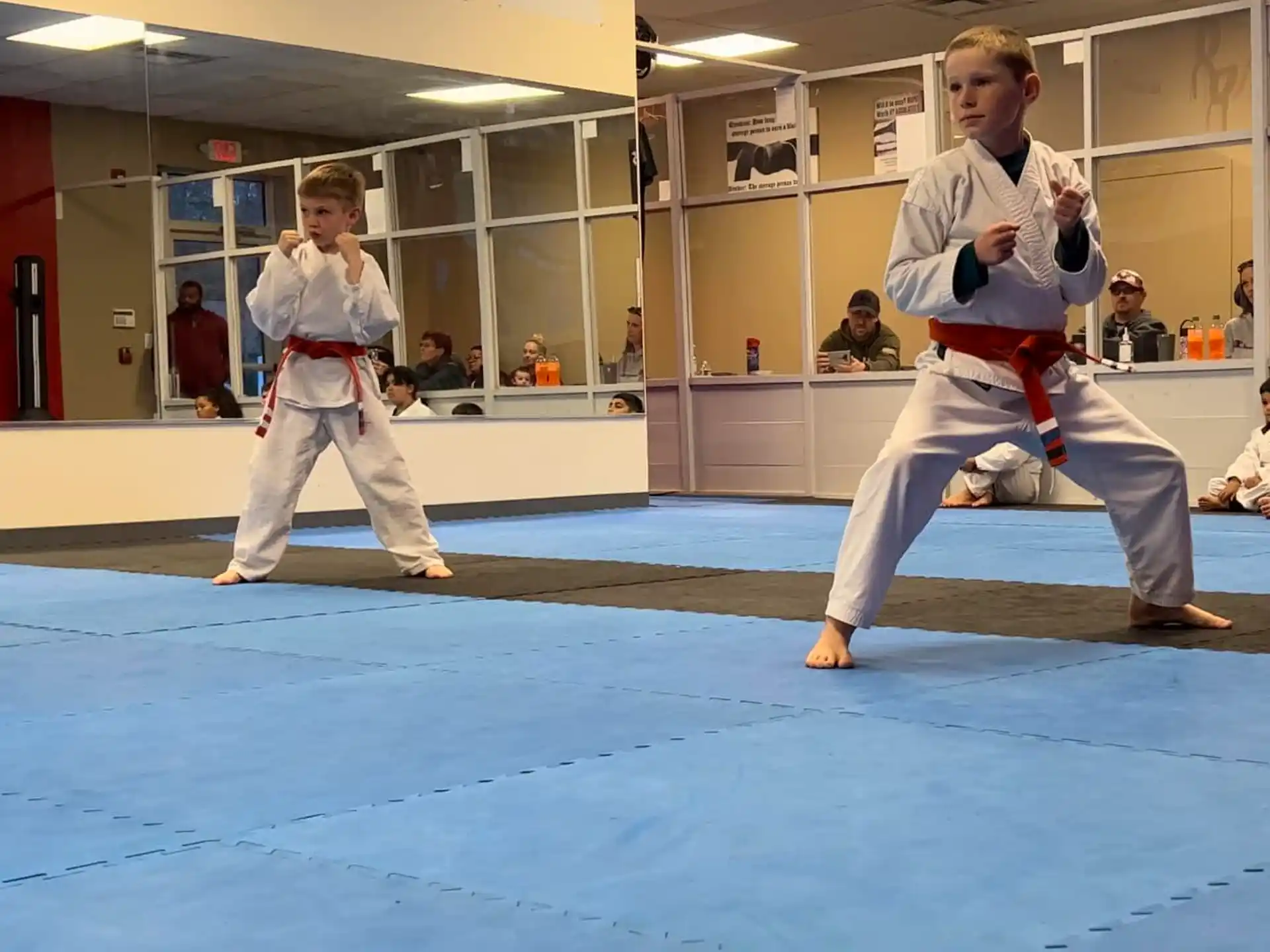 a couple of people in karate uniforms