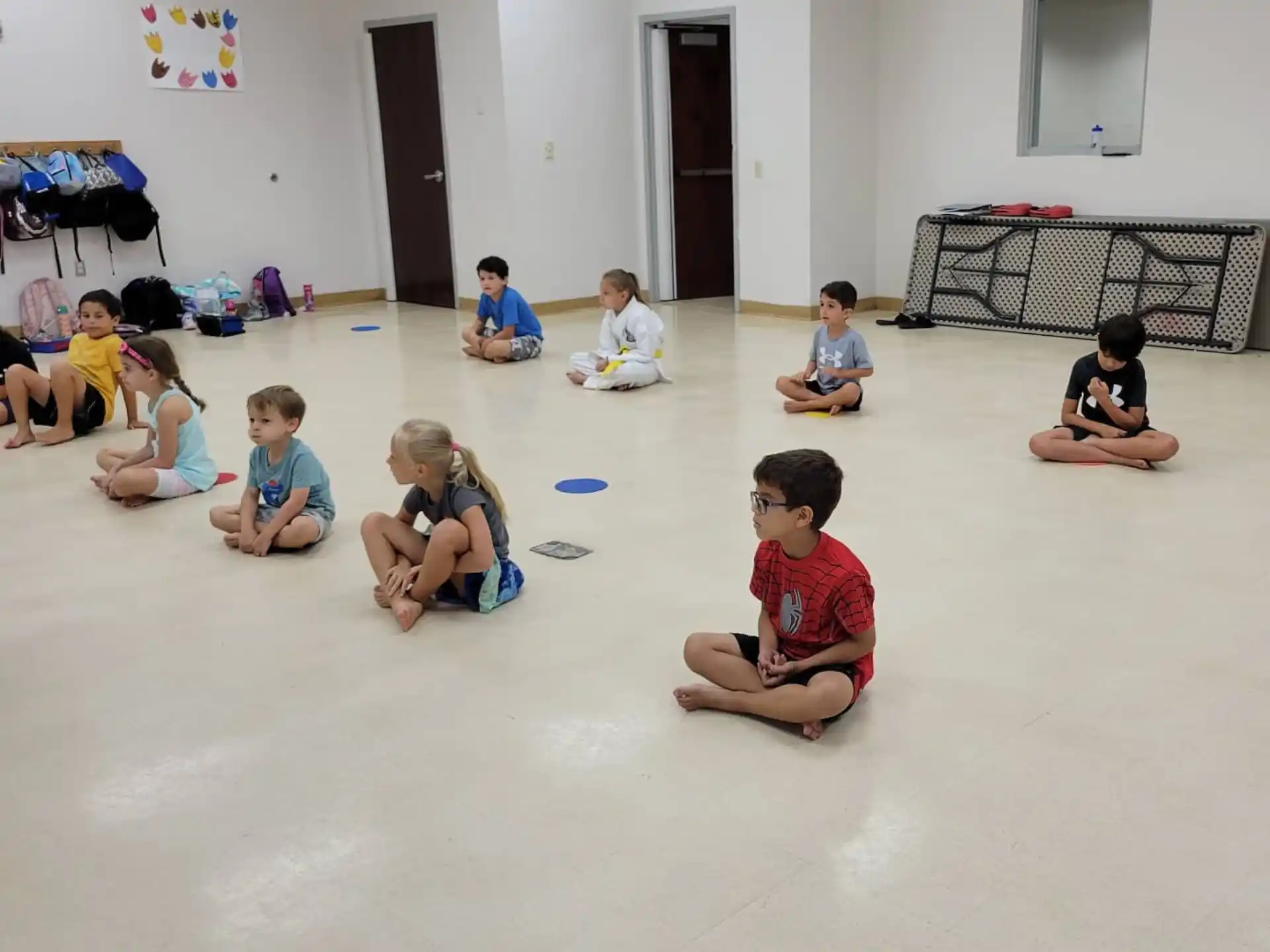 a group of children sitting on the floor