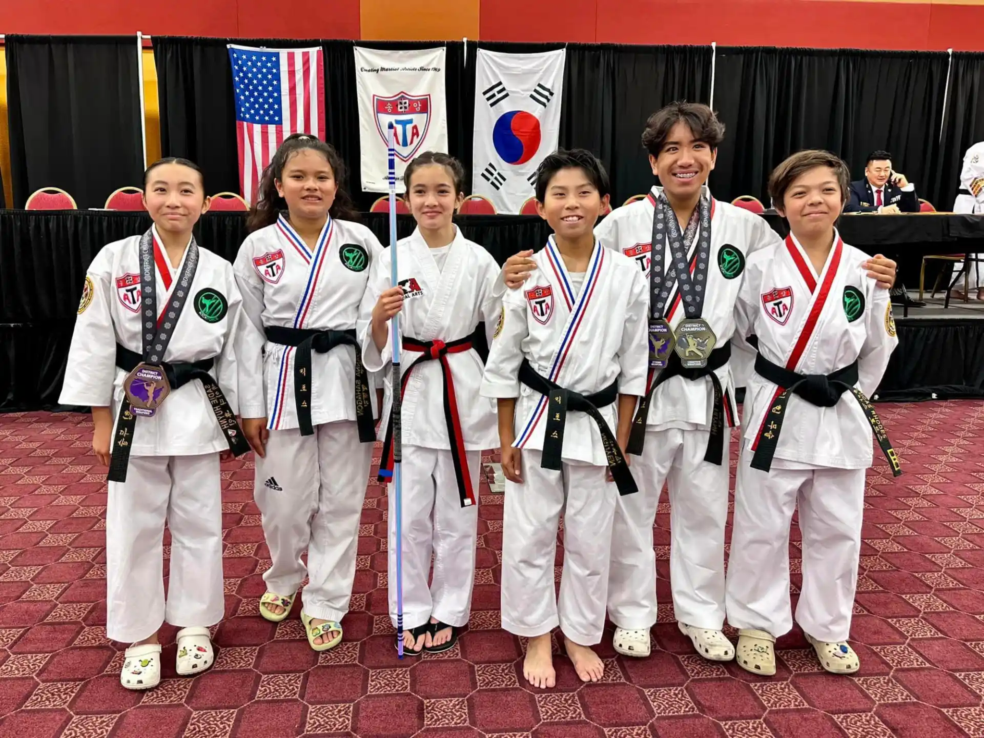 a group of people in karate uniforms