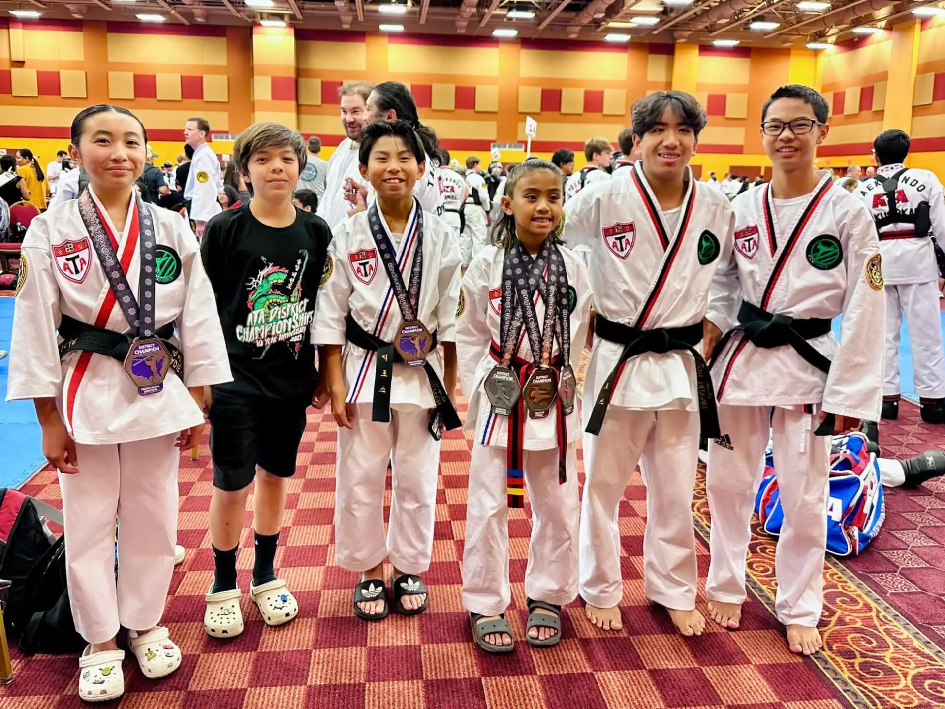 a group of people wearing medals