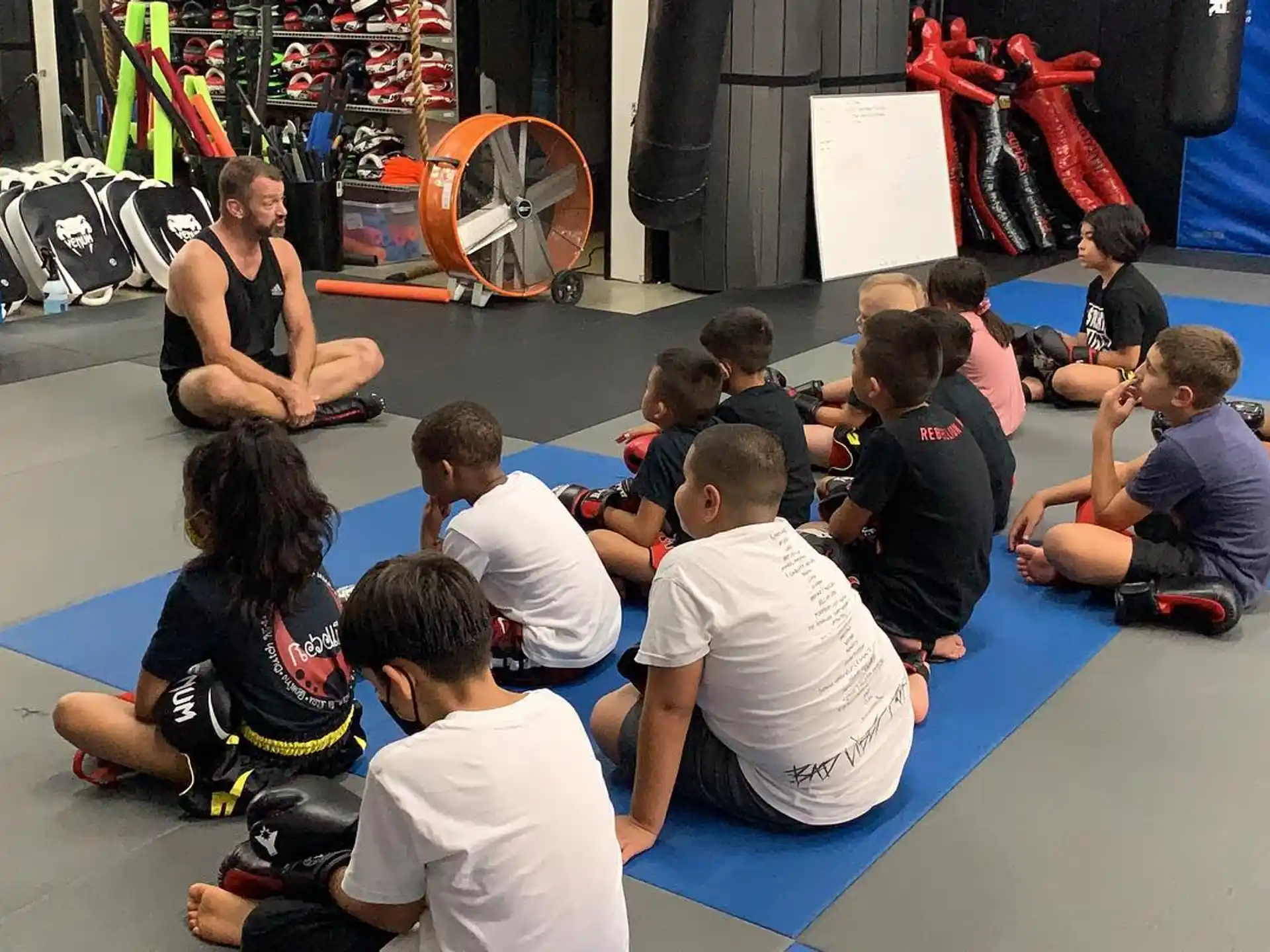 a group of people sitting on the floor