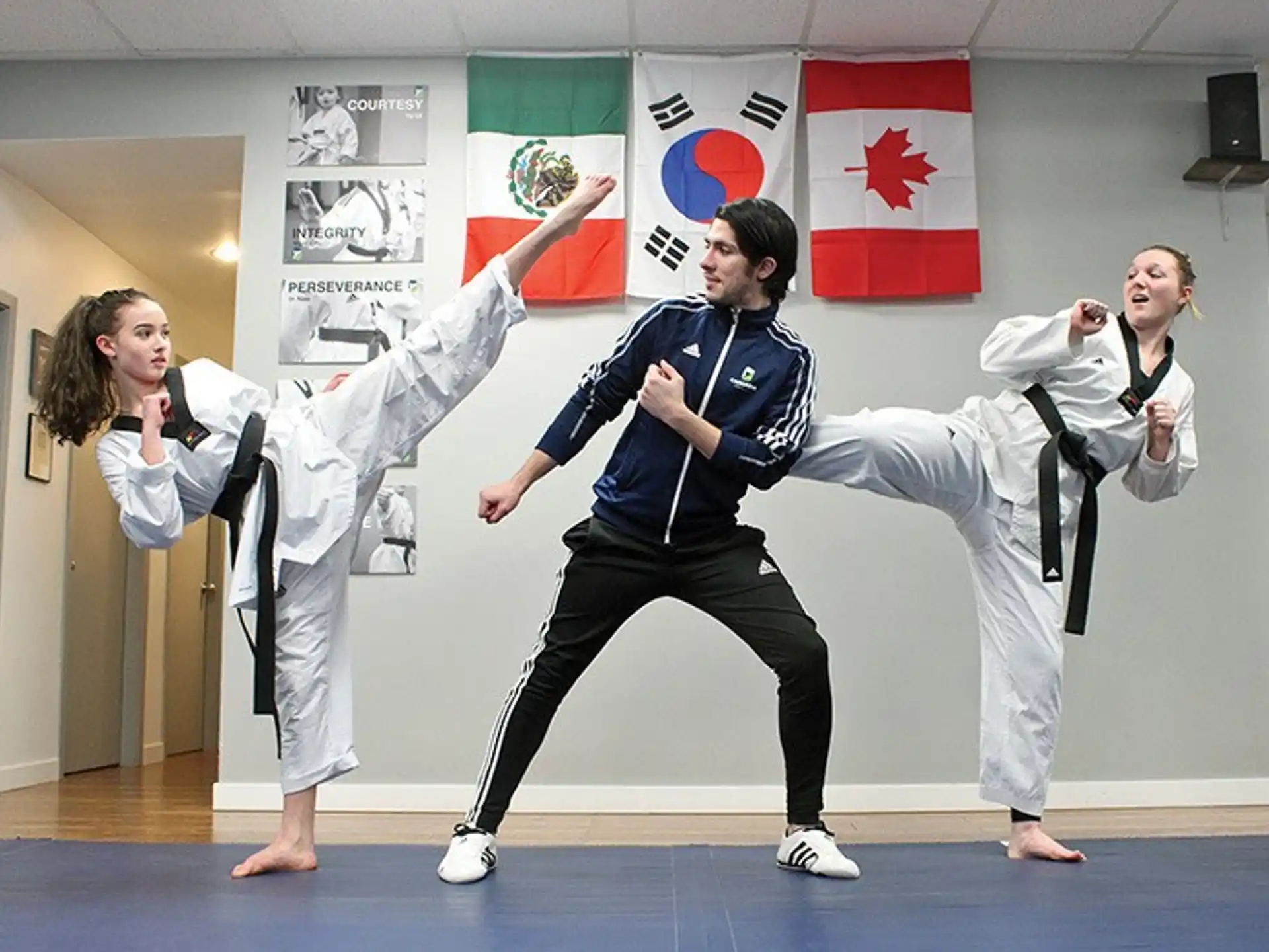 a group of people in karate uniforms