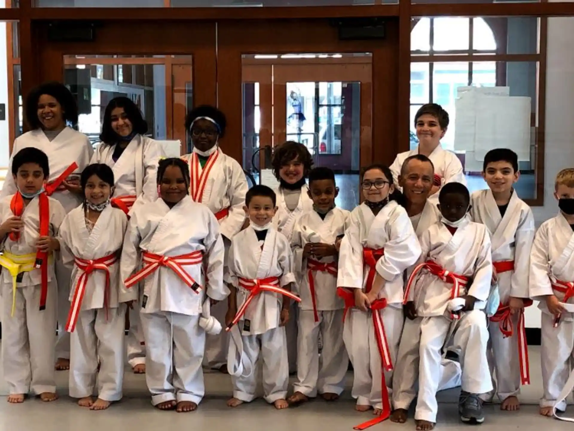 a group of people in karate uniforms
