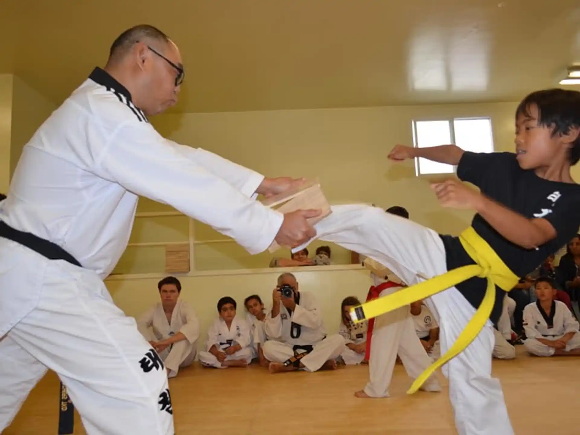 a man and a boy practicing karate
