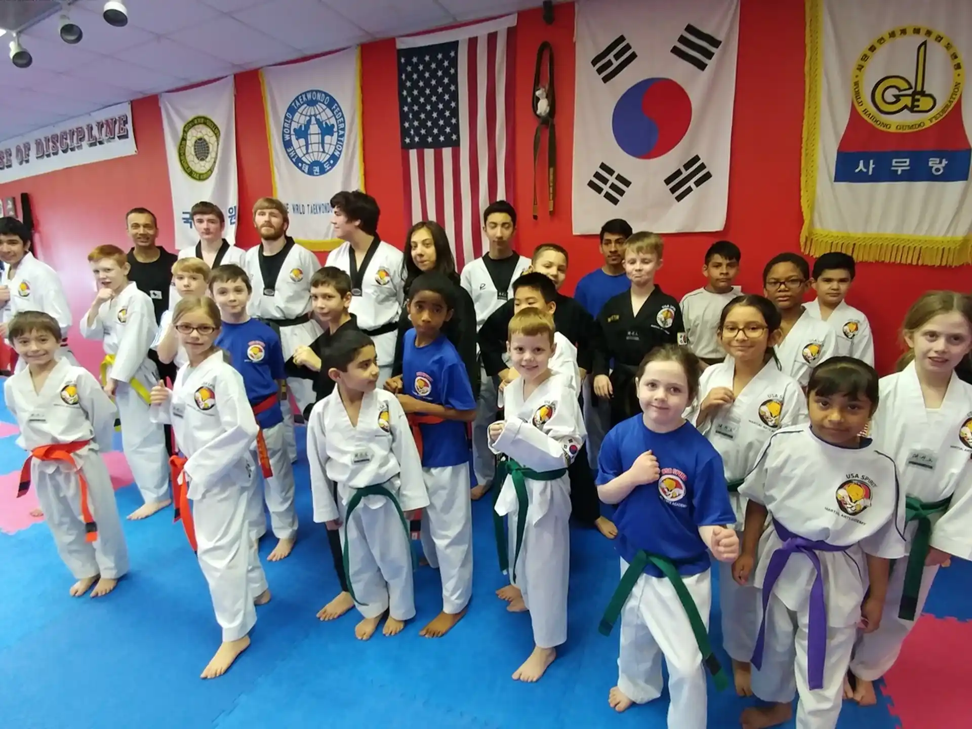 a group of people in karate uniforms