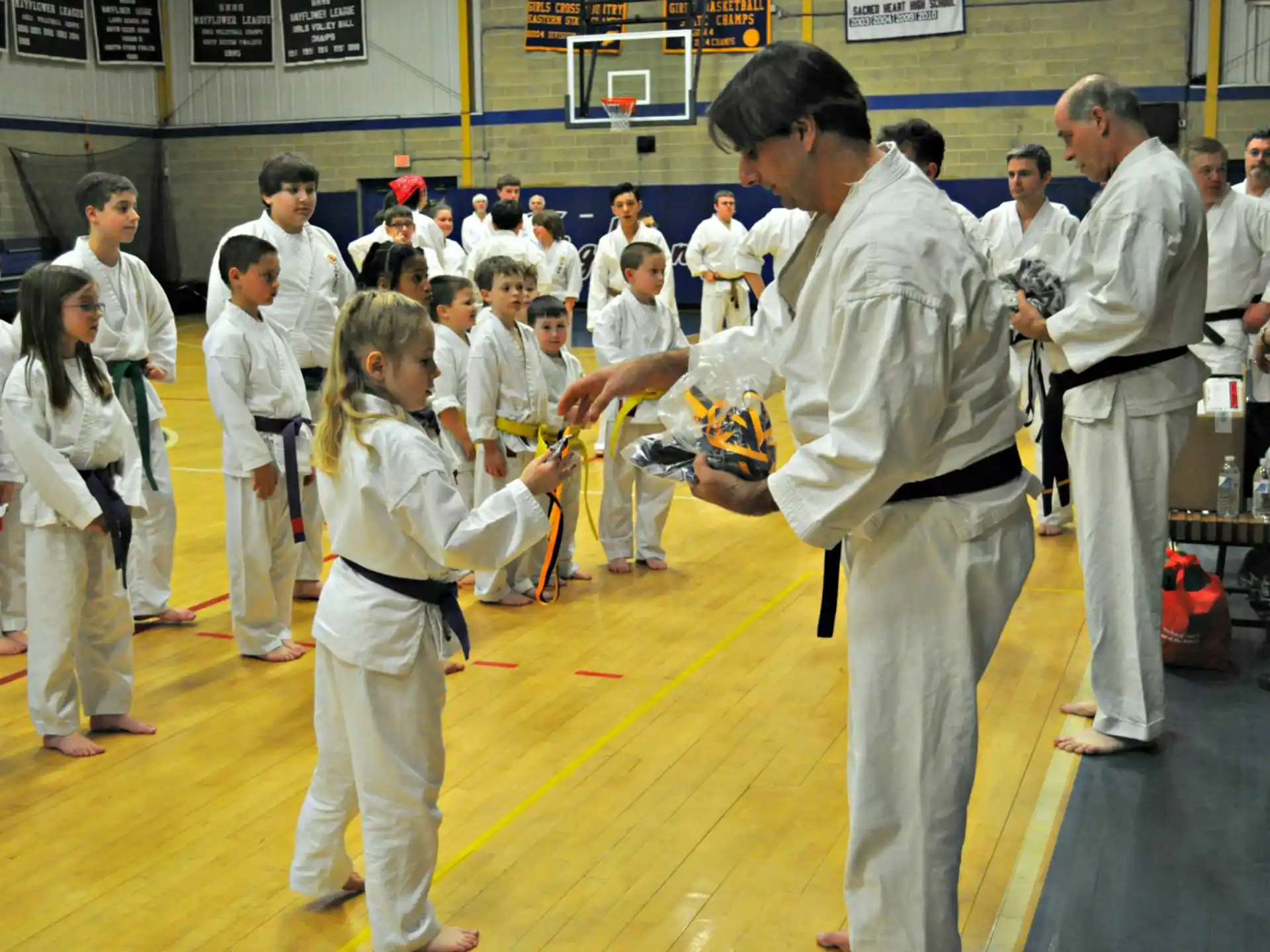 a group of people in karate uniforms