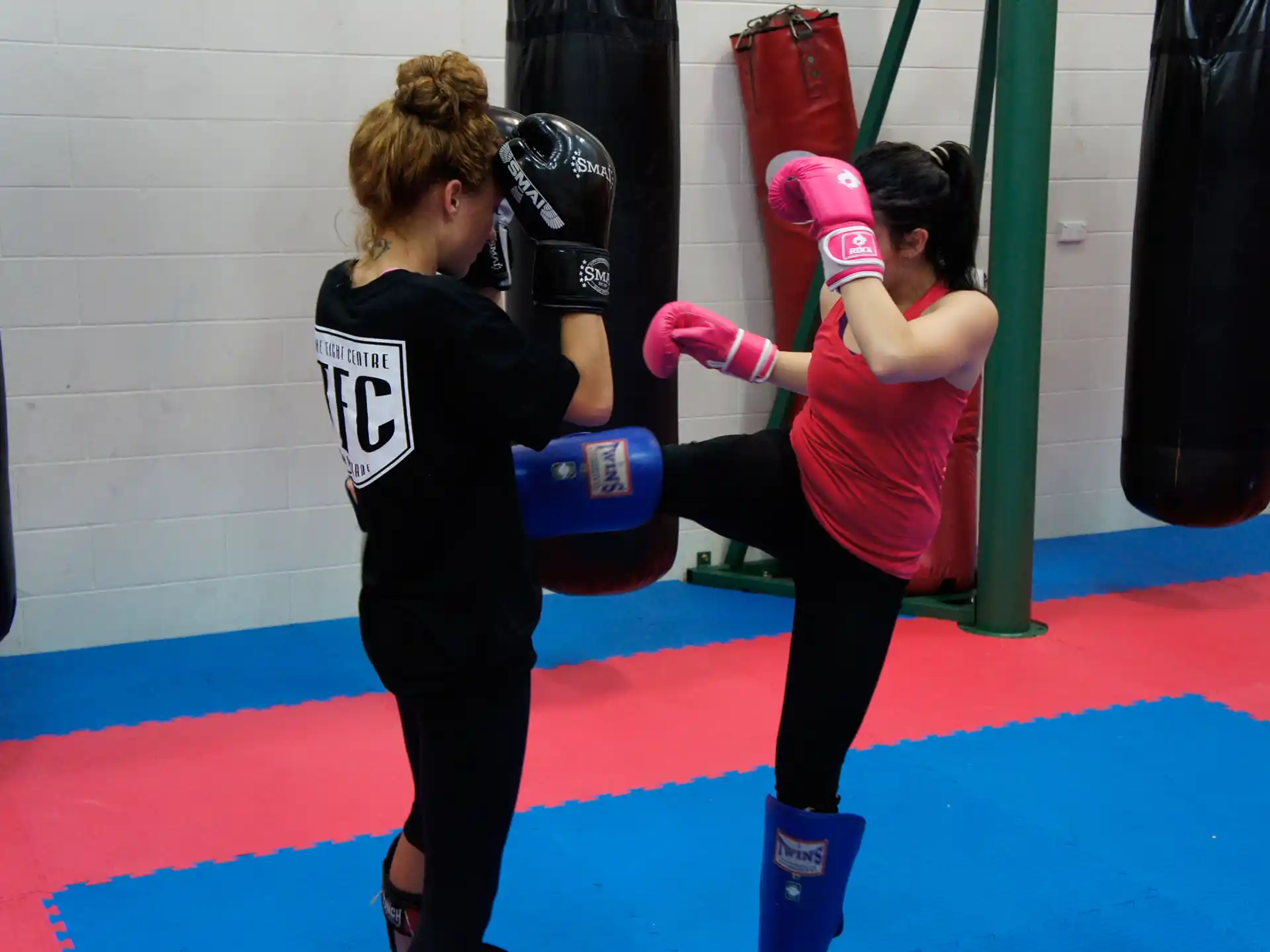 a couple of women in boxing gloves