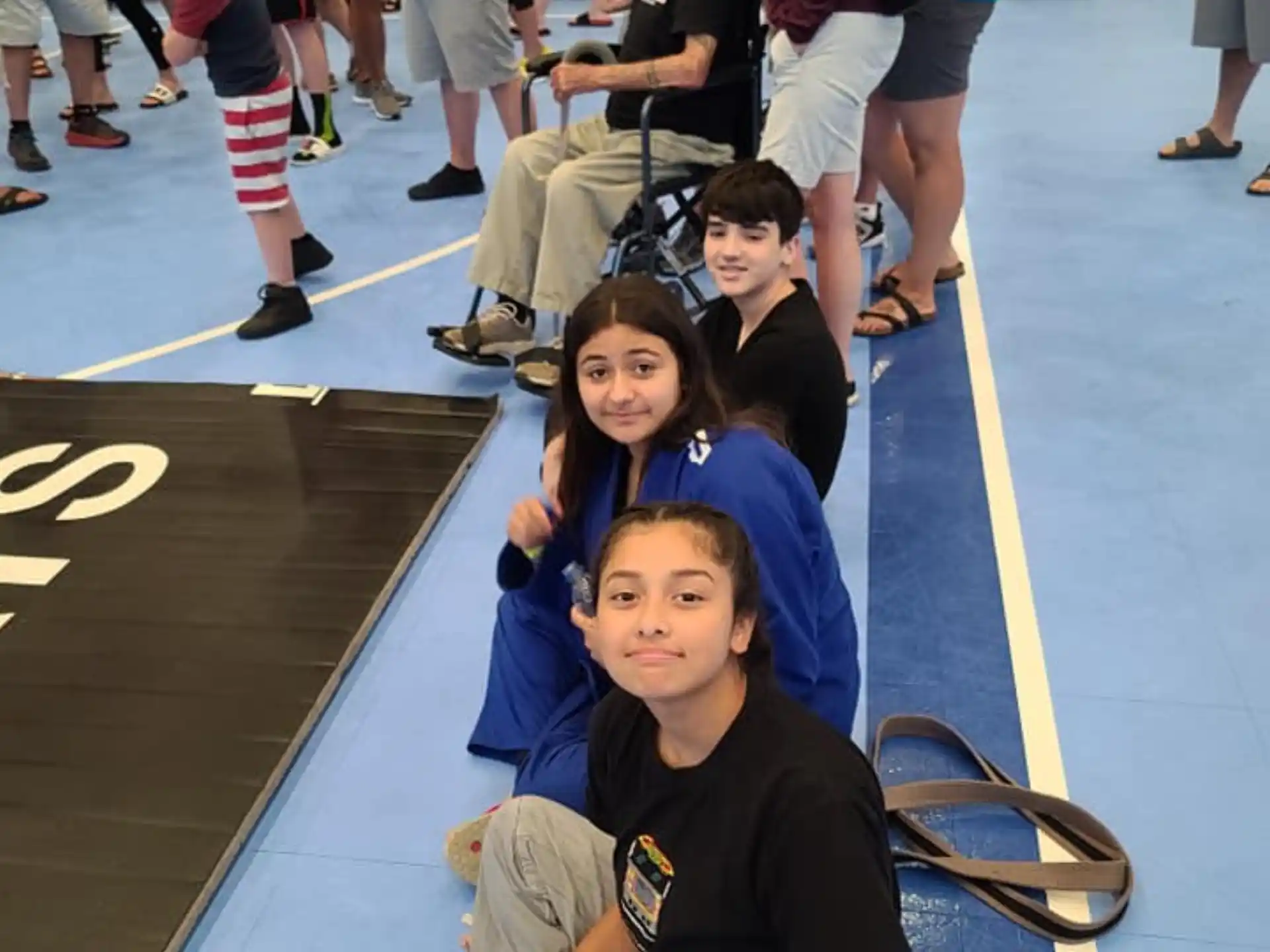 a group of people sitting on the floor