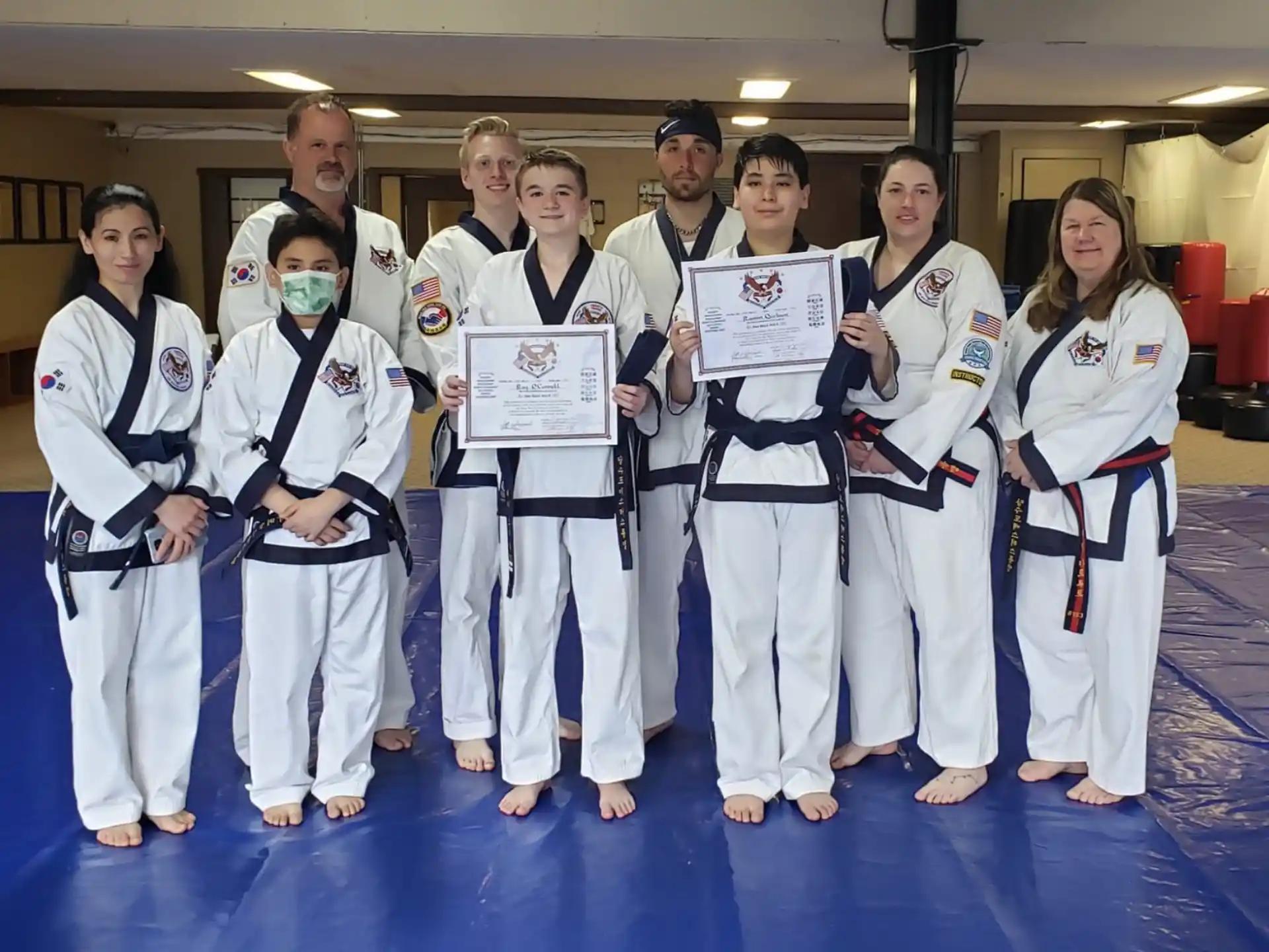 a group of people in karate uniforms