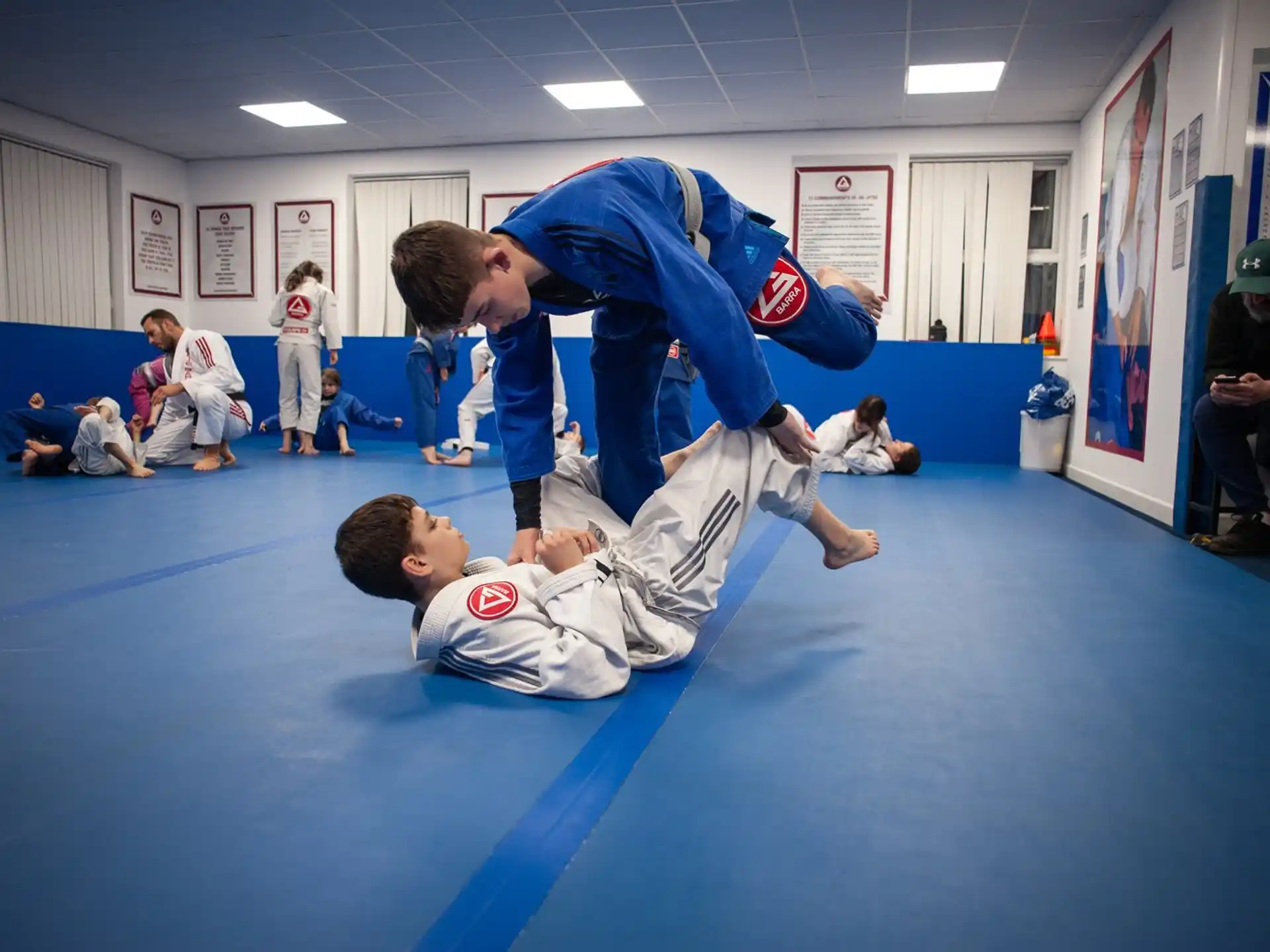 a man kicking another man in the face