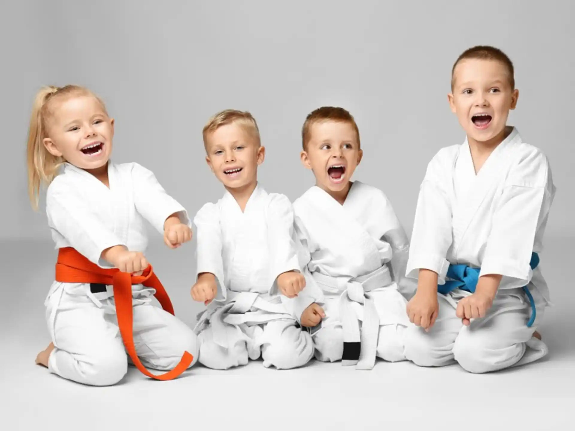 a group of children sitting and laughing