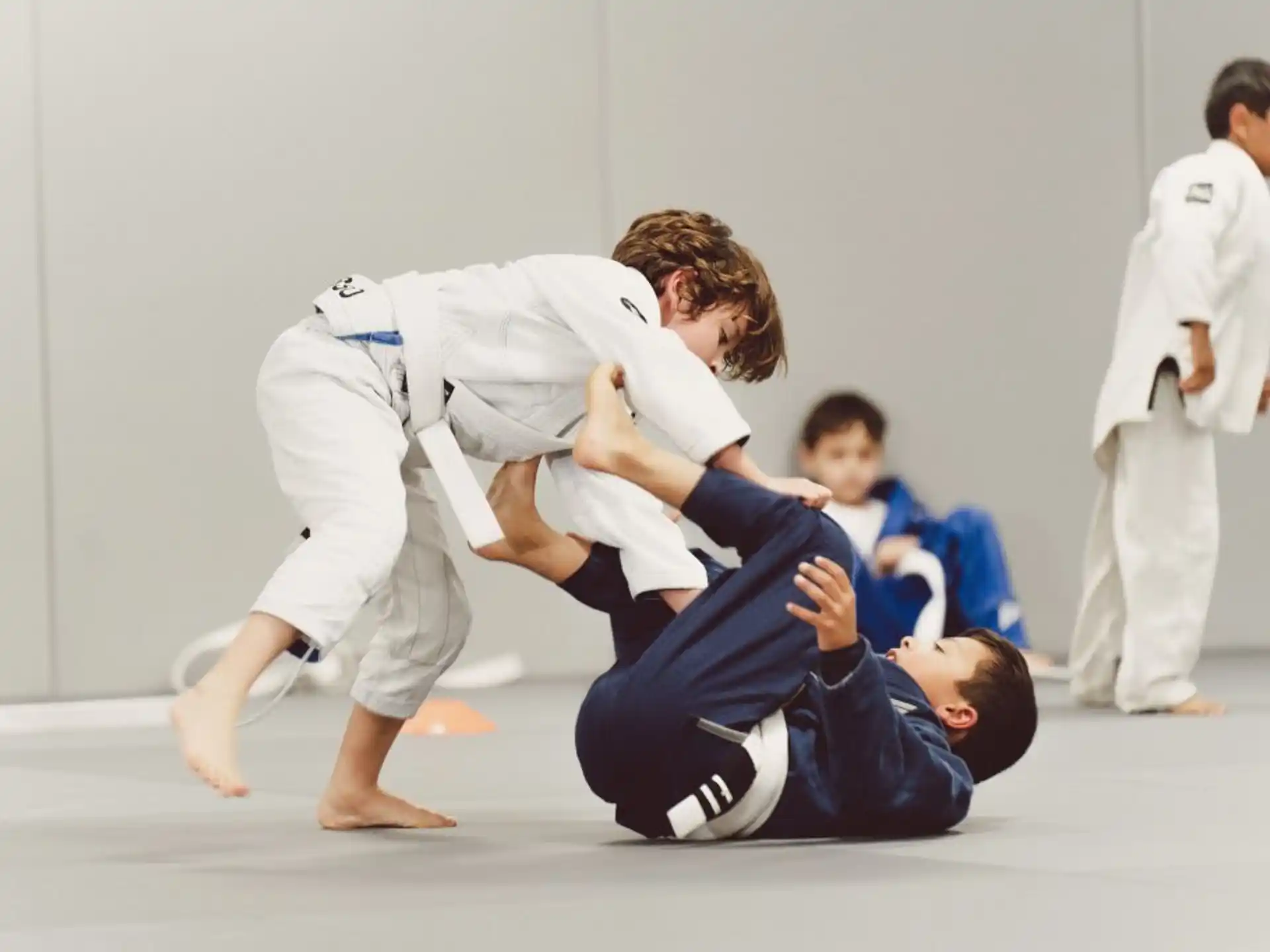 a group of people in karate uniforms