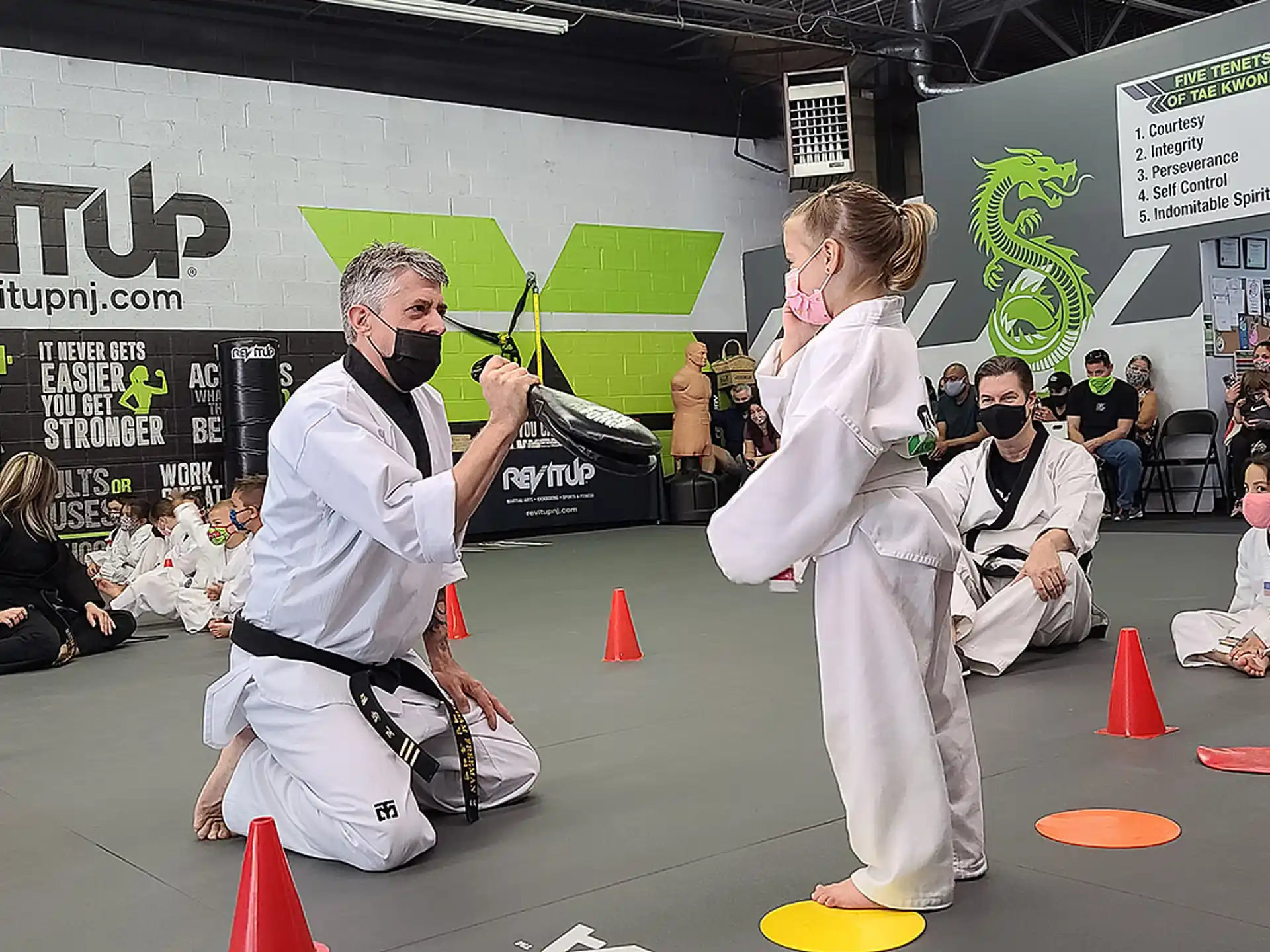 a man and woman in karate uniforms