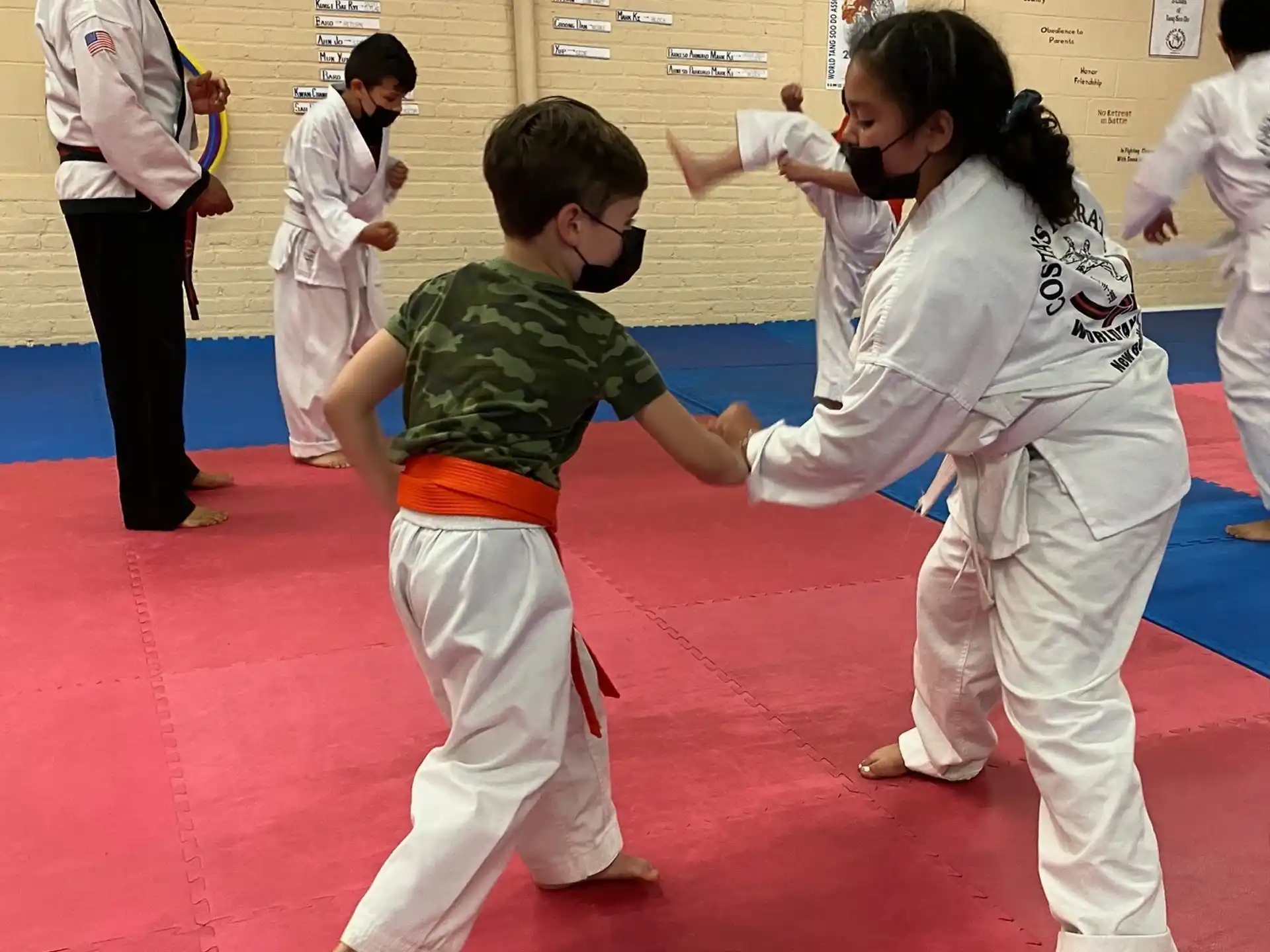 a group of people in karate uniforms