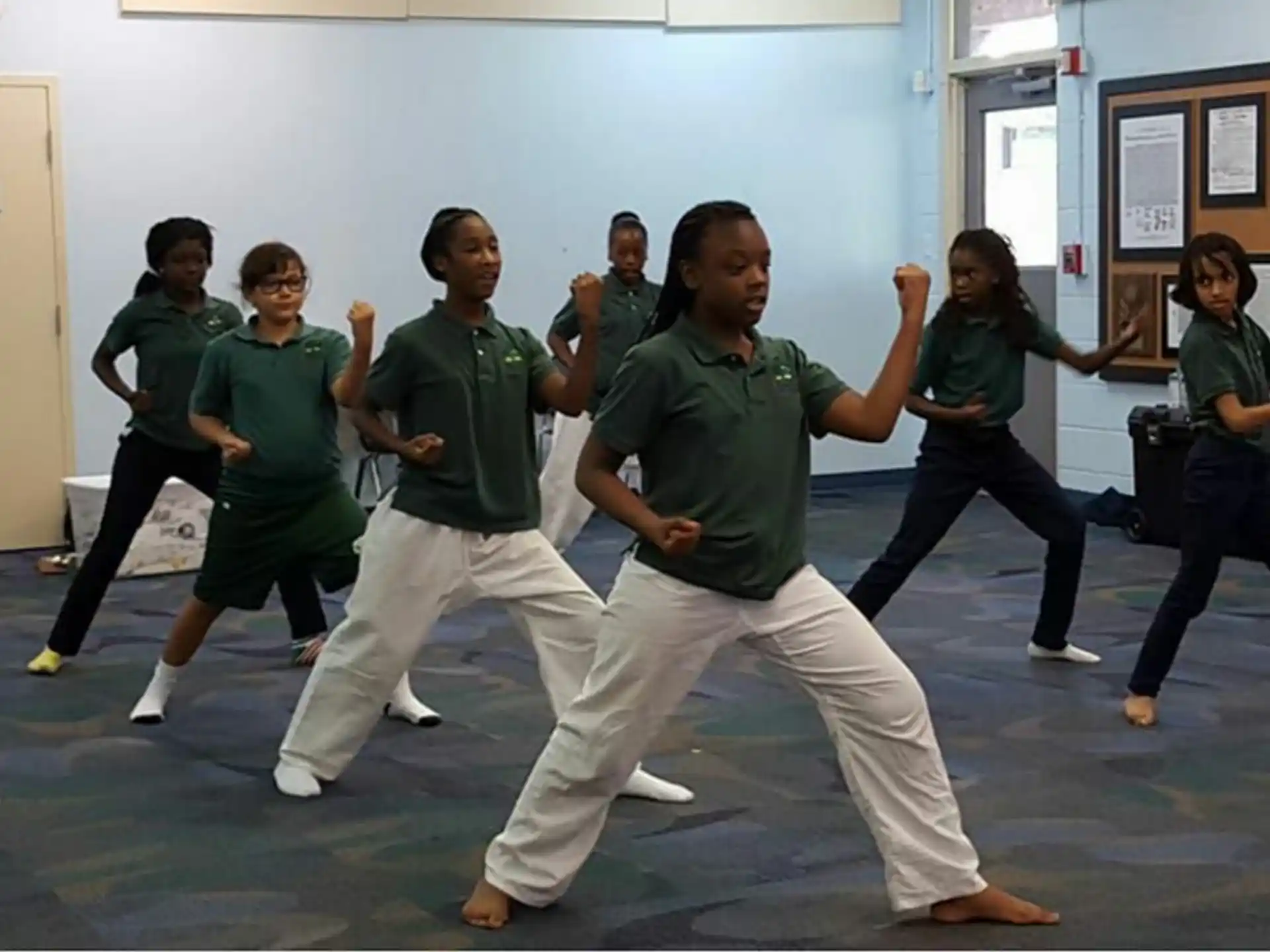 a group of people in a karate class