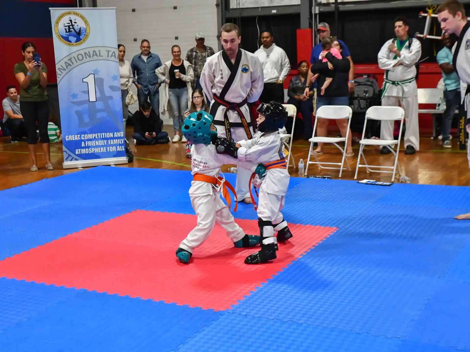 a couple of kids in karate uniforms