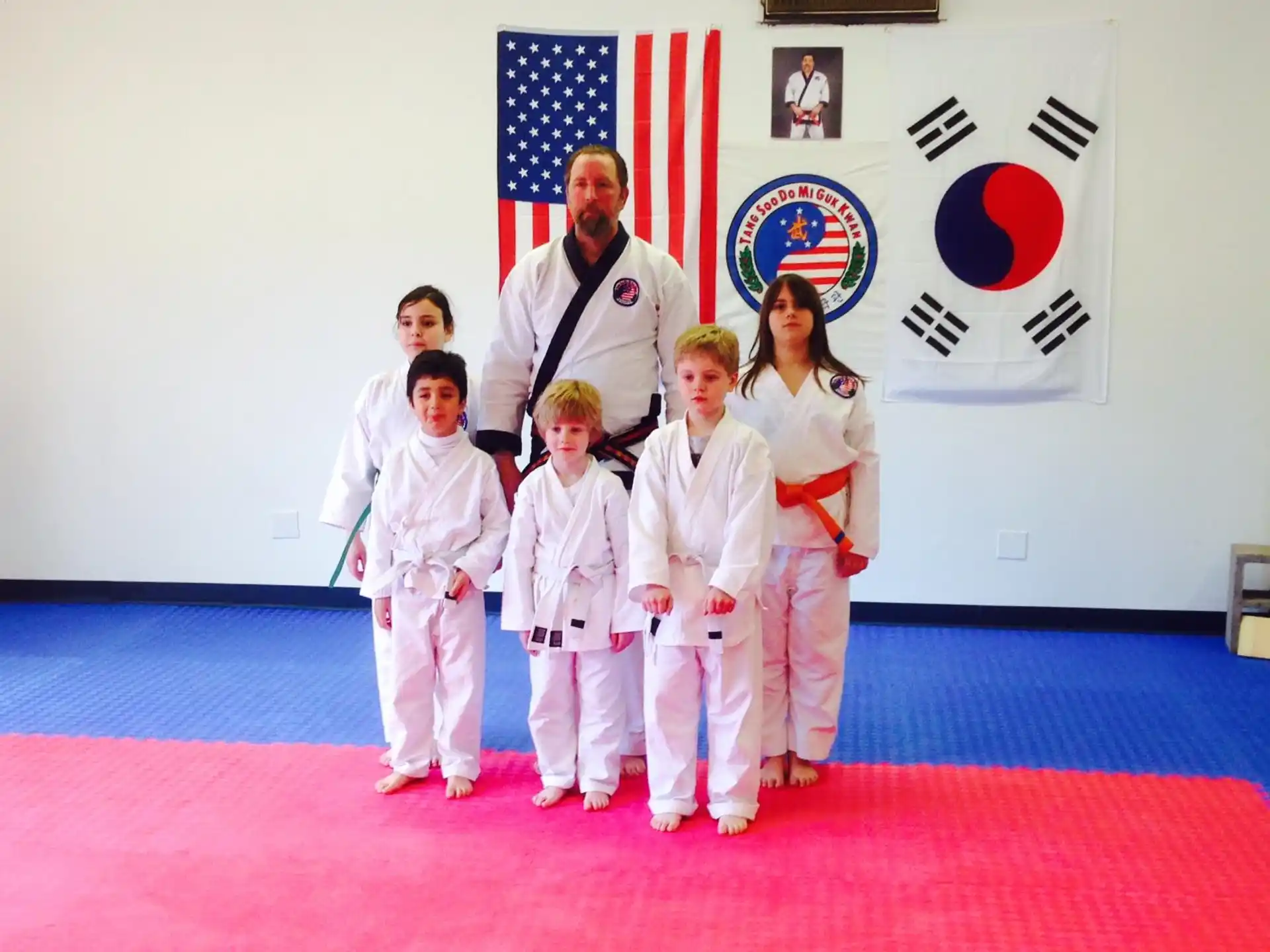 a group of people in karate uniforms
