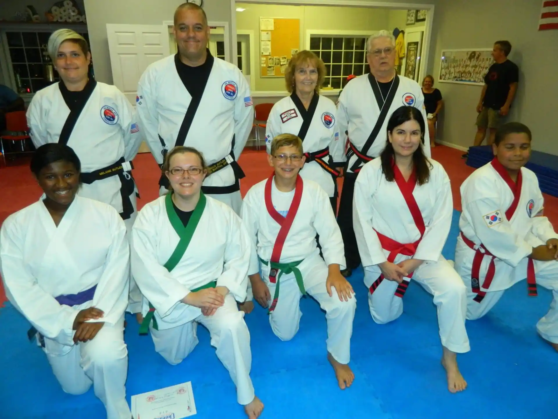 a group of people wearing white uniforms