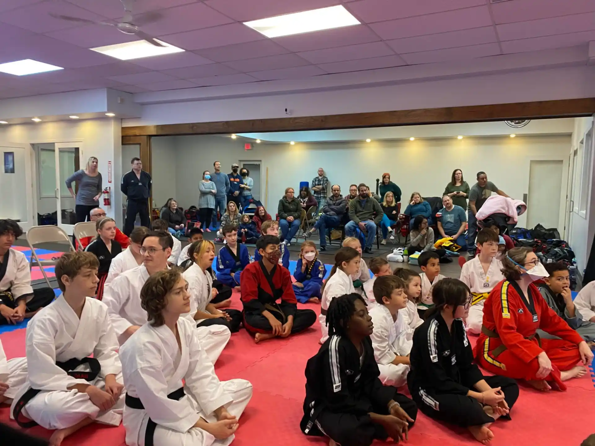 a group of people sitting on the floor
