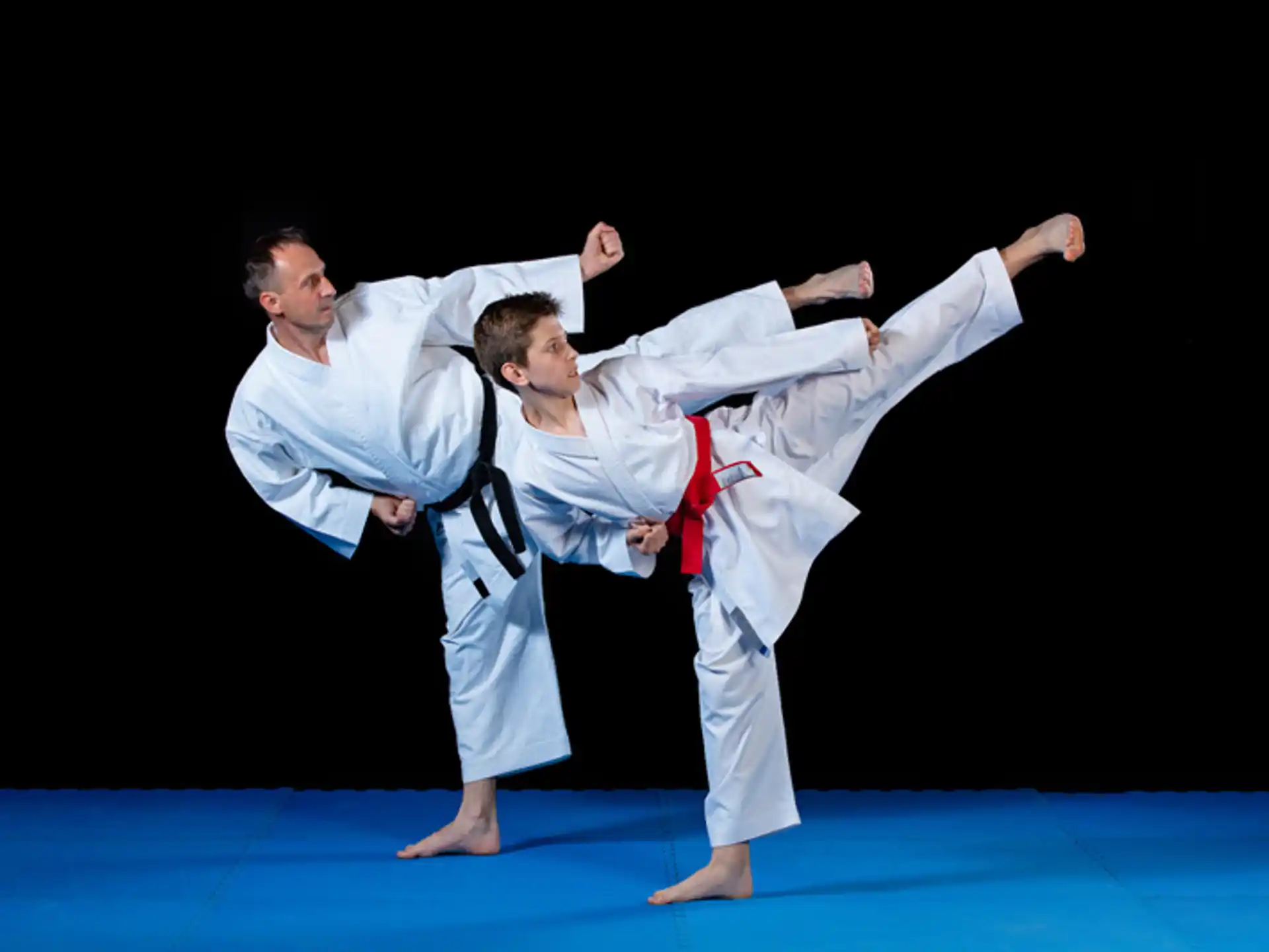 a man and a woman in karate uniforms