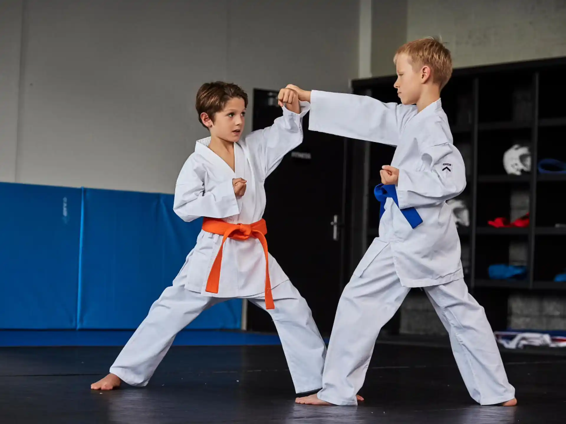 two boys in karate uniforms