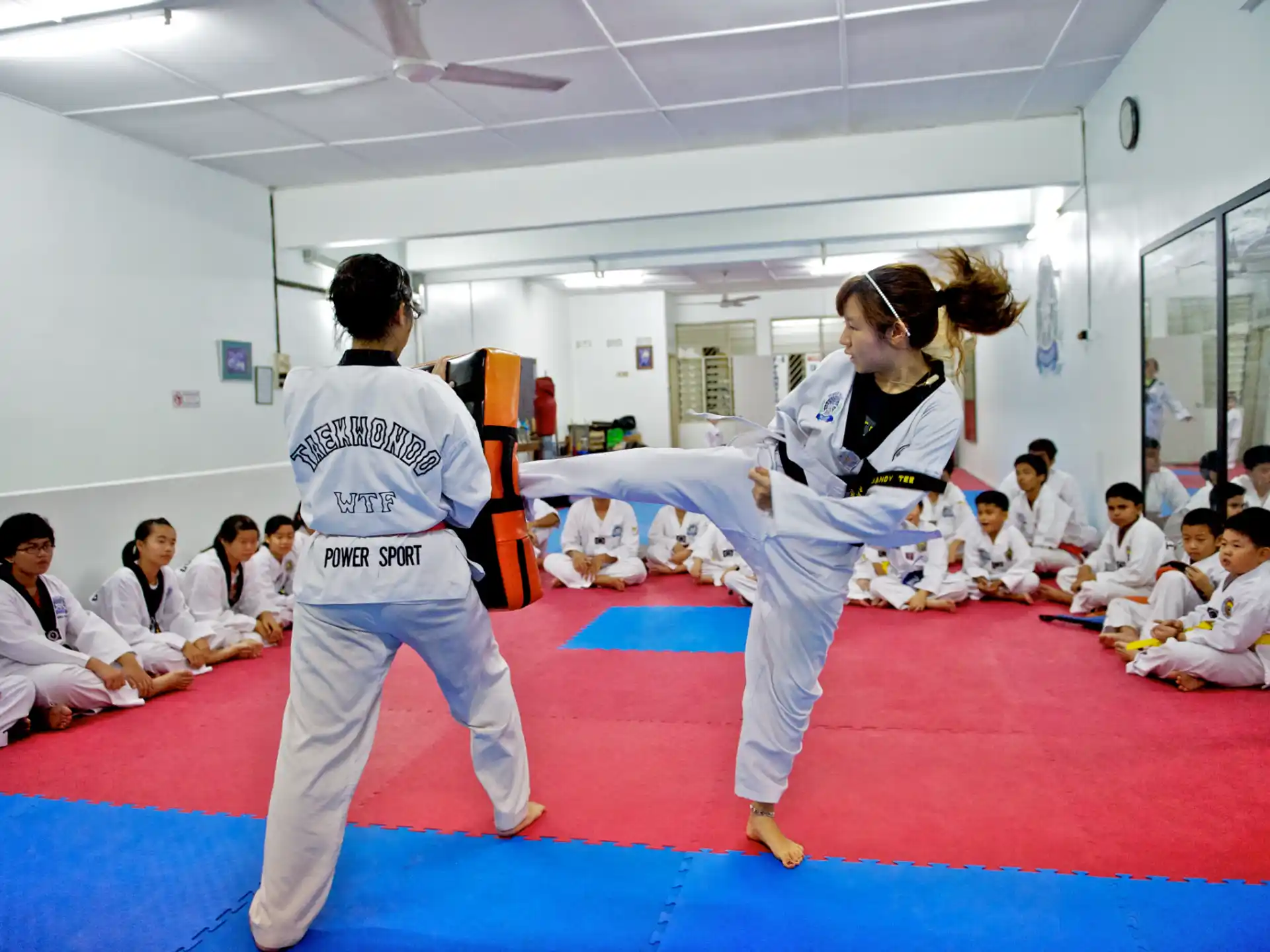 a couple of people in karate uniforms