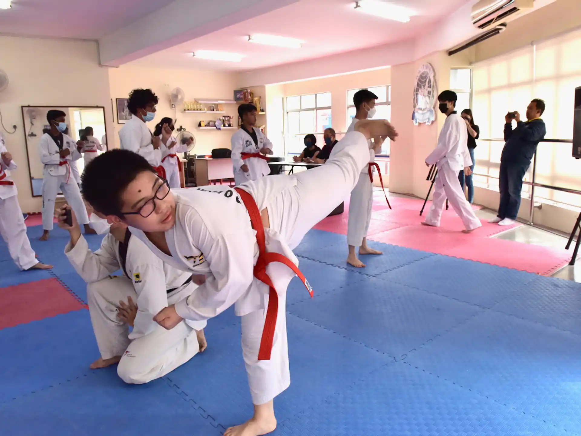 a group of people in karate uniforms