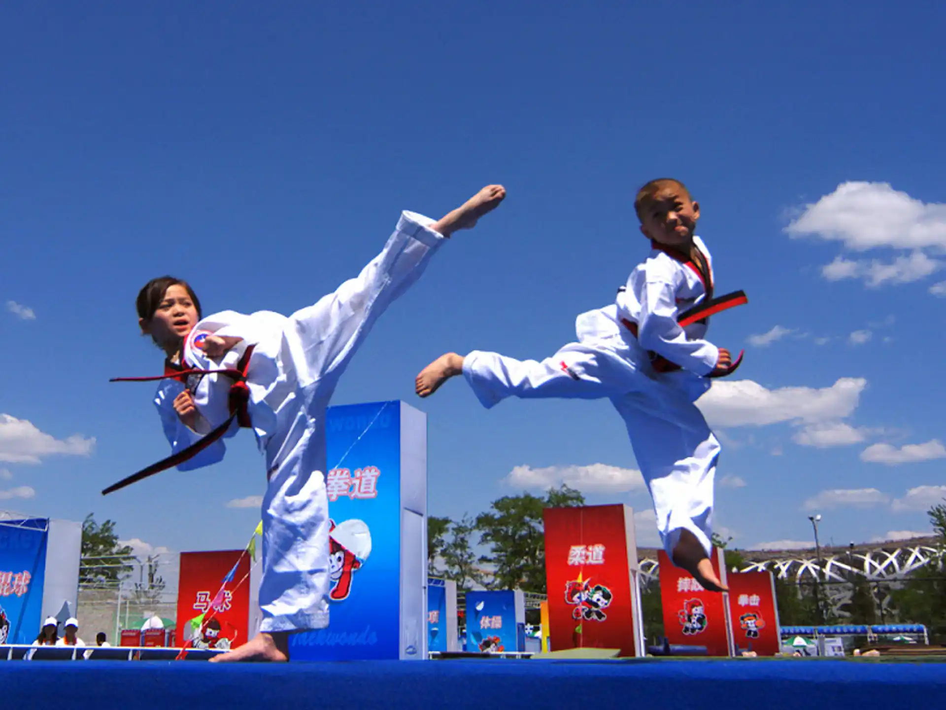 a man and woman jumping in the air