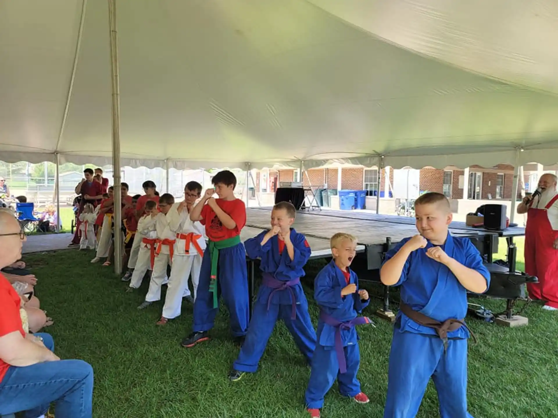 a group of children in karate uniforms