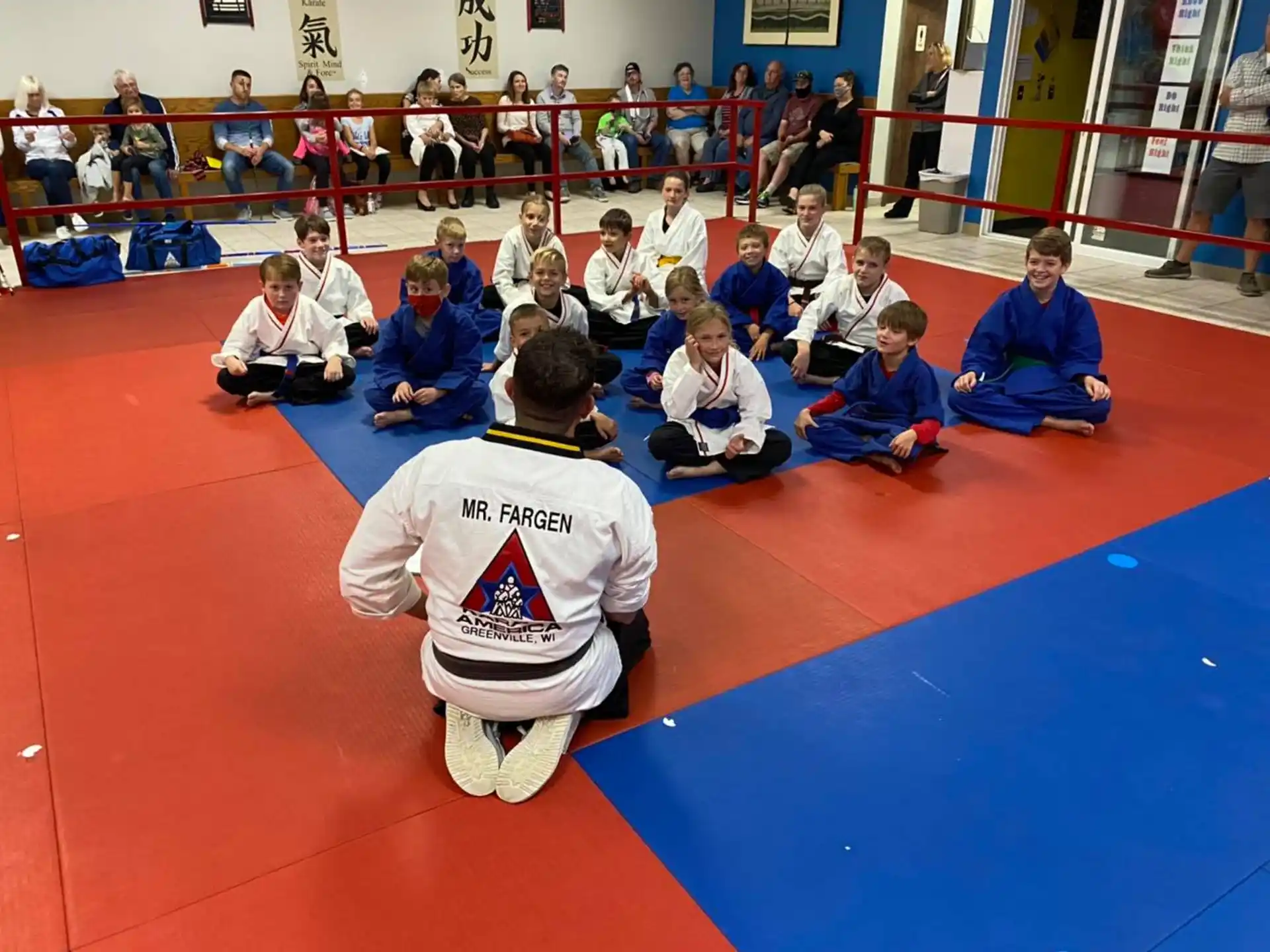 a group of people sitting on the floor
