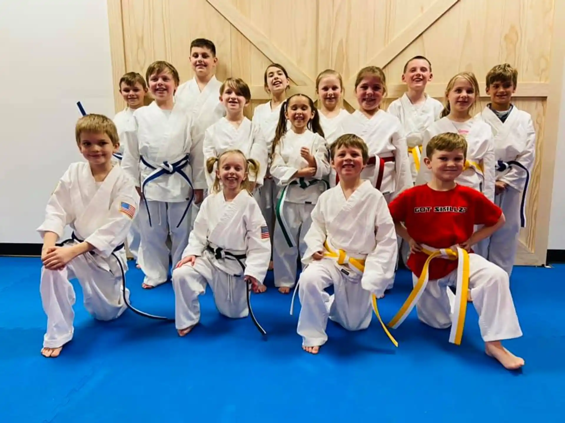 a group of people in karate uniforms