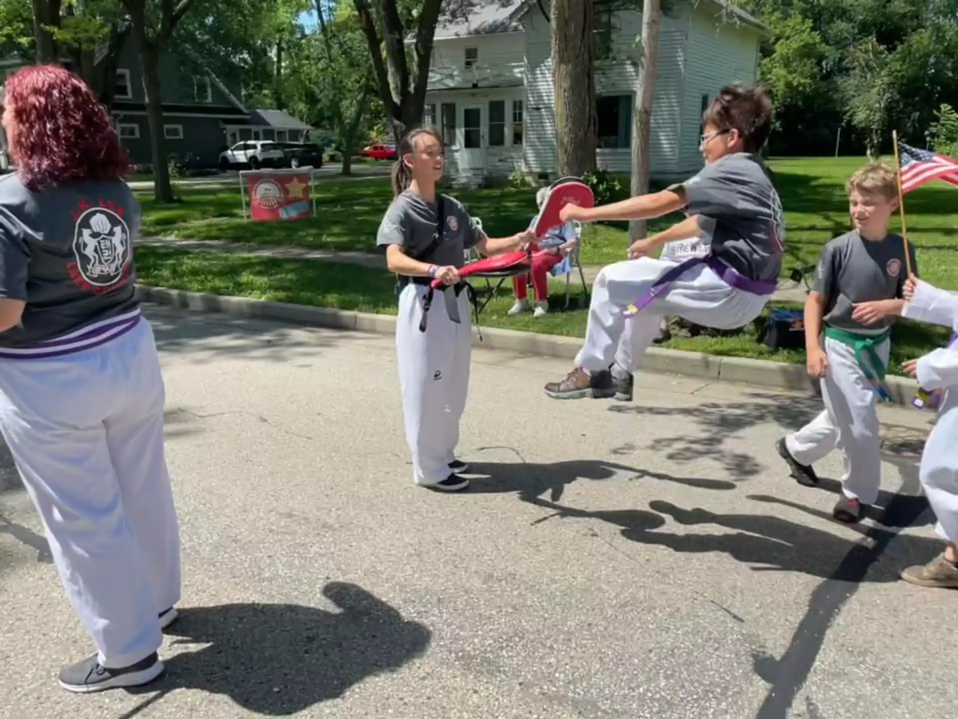 a group of people playing with a toy sword