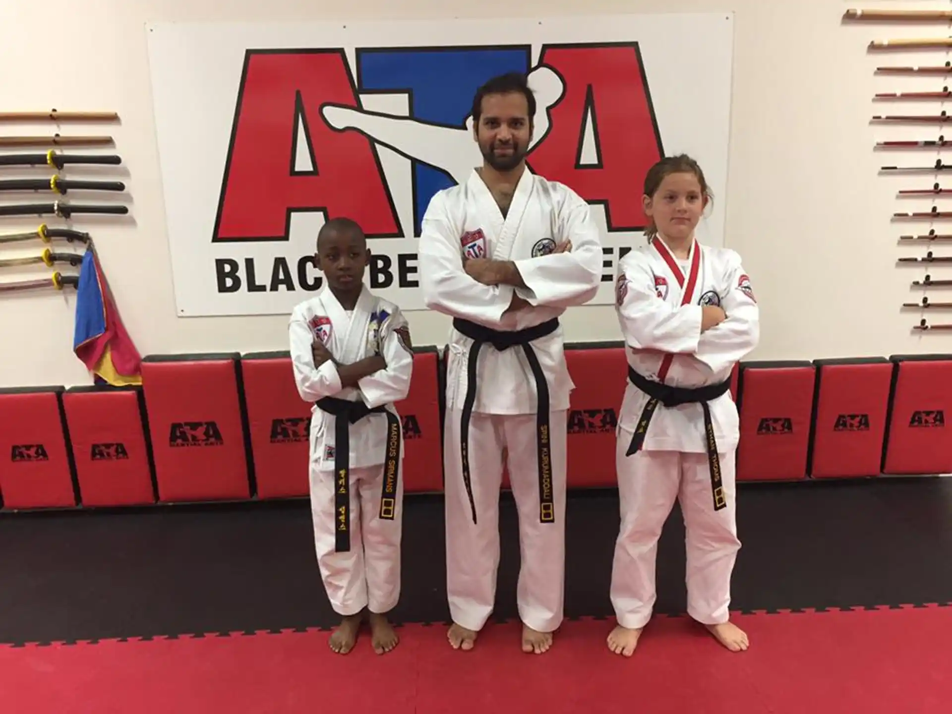a group of people in karate uniforms