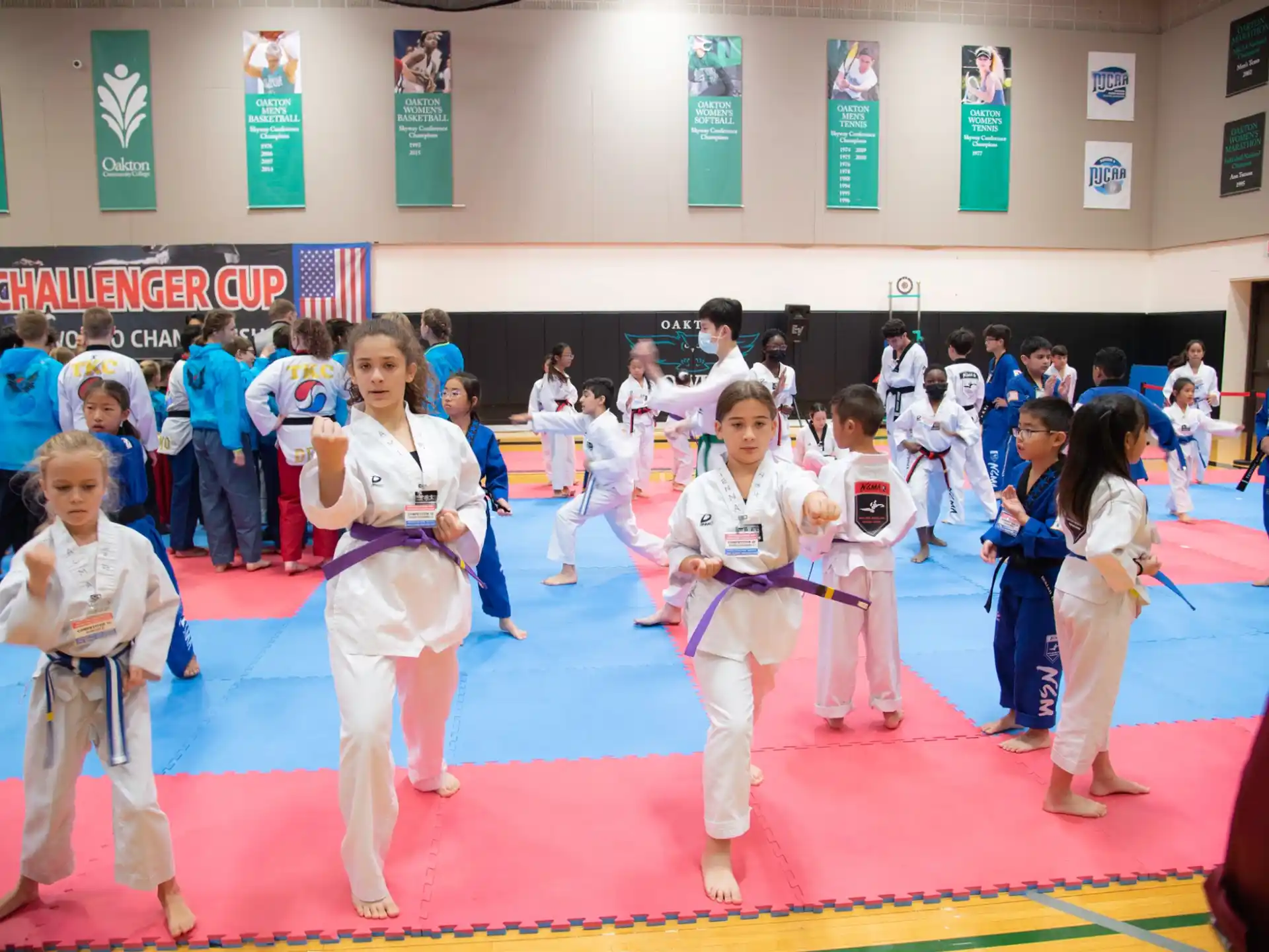 a group of people in karate uniforms